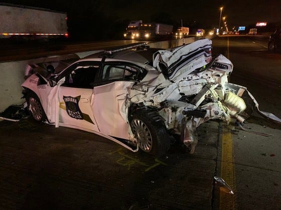 An Indiana State Trooper was injured Wednesday morning after his squad car was rear-ended while investigating a previous accident on I-80/94, police said.