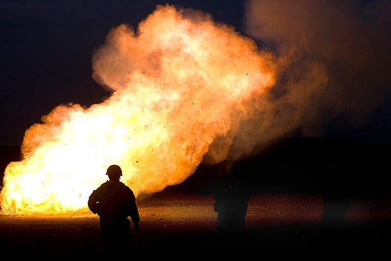 U.S. Army Staff Sgt. Alexis Castillo watches as unused mortar ‘cheese’ charges are disposed by fire during a mortar training exercise with Iraqi soldiers.