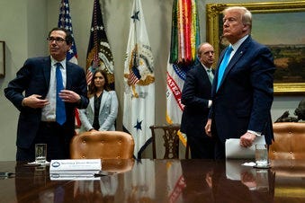Treasury Secretary Steven Mnuchin and President Donald Trump listen to a question during a conference call with banks on efforts to help small businesses during the coronavirus pandemic. (AP Photo/Evan Vucci)