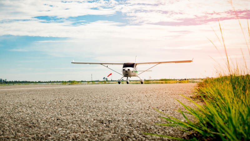 Small airplane on a taxiway - stock photo