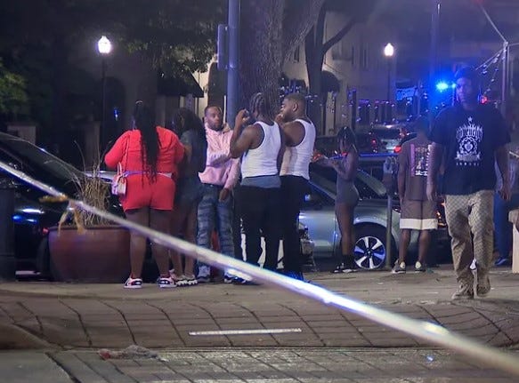 s bystanders near the scene of a shooting