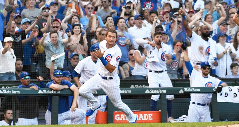 Cubs outfielder Albert Almora Jr. rounds third base as he scores a run.