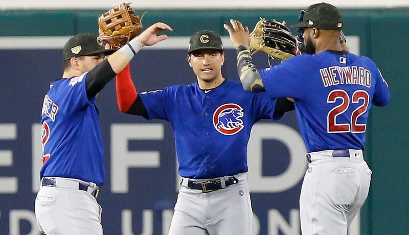 Cubs outfielders Kyle Schwarber (12), Albert Almora Jr. (5) Jason Heyward (22) celebrate. a win.