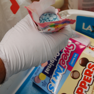Authorities today seized several fentanyl pills hidden inside bags and boxes of candy that a suspect attempted to smuggle through TSA screening at LAX.