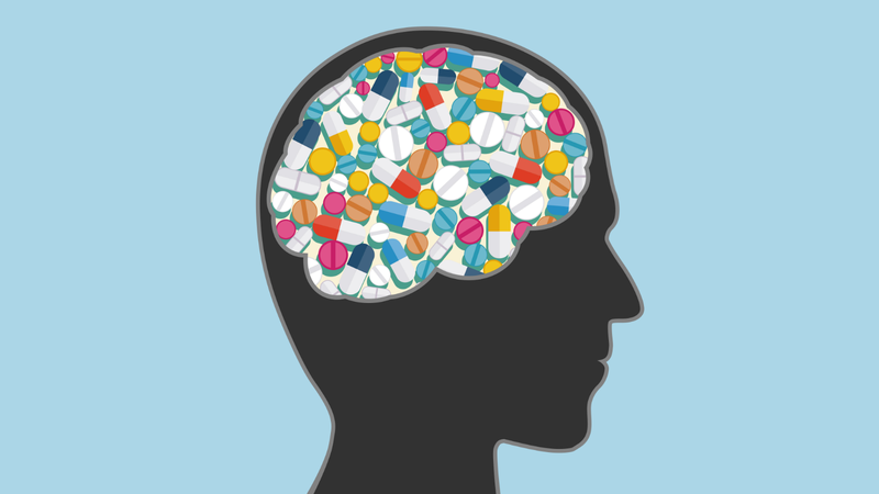 Vector illustration of vitamins, pills, Alzheimer's drug in the human head.