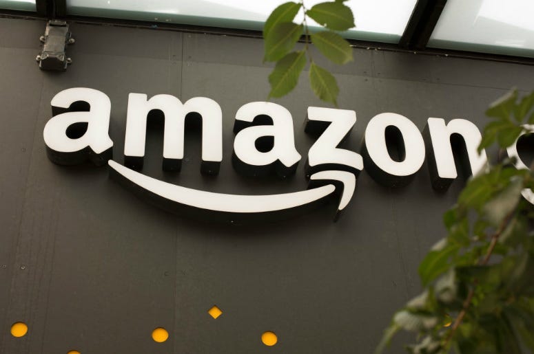 A portion of the sign advertising Amazon Go is seen outside the grocery store's location on June 16, 2017 in Seattle, Washington. Amazon announced that it will buy Whole Foods Market, Inc. for over $13 billion dollars.