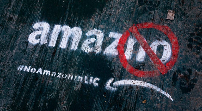 Amazon graffiti on a sidewalk by someone opposed to the location of the Amazon Headquarters in Queens, New York. 