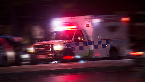 FILE: Ambulance with lights on.