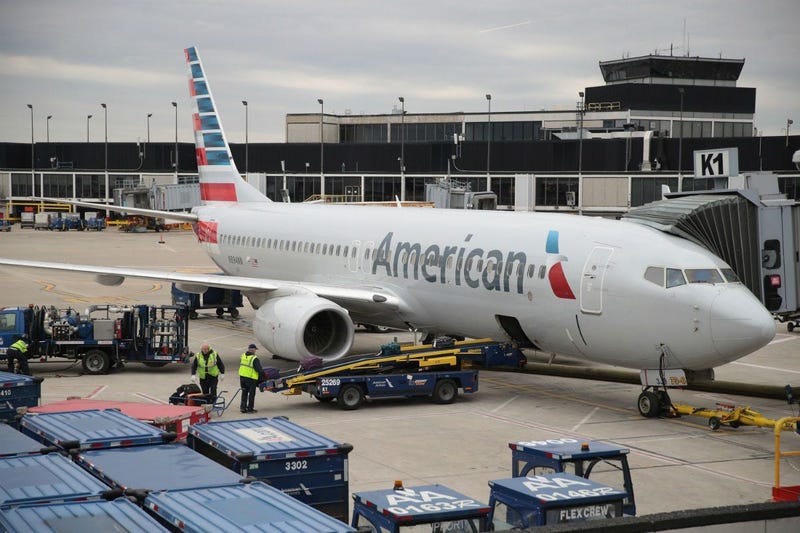 Workers load luggage onto an American Airlines aricraft at O'Hare International Airport on May 11, 2018 in Chicago, Illinois. Today American Airlines held a ceremony to mark the opening of five new gate at the airport.