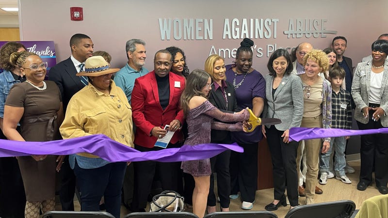 Women Against Abuse representatives cut the ribbon on the renovated Ameya's Place domestic violence shelter.