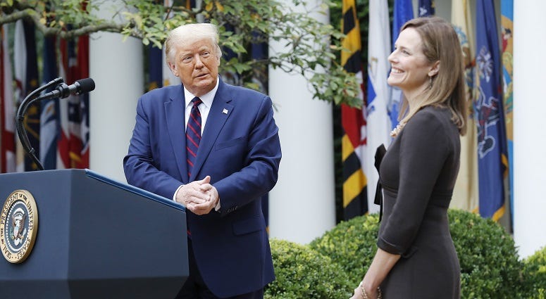 US President Donald J. Trump intriduces Judge Amy Coney Barrett (R) as his nominee to be an Associate Justice of the Supreme Court during a ceremony in the Rose Garden of the White House in Washington, DC