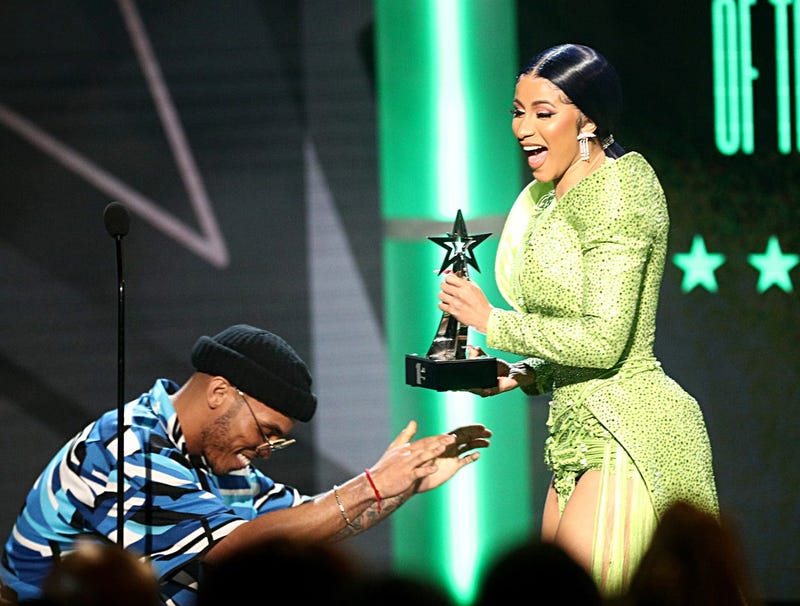 LOS ANGELES, CALIFORNIA - JUNE 23: (L-R) Anderson .Paak presents the Album of the Year award to Cardi B for 'Invasion of Privacy' onstage at the 2019 BET Awards at Microsoft Theater on June 23, 2019 in Los Angeles, California. 