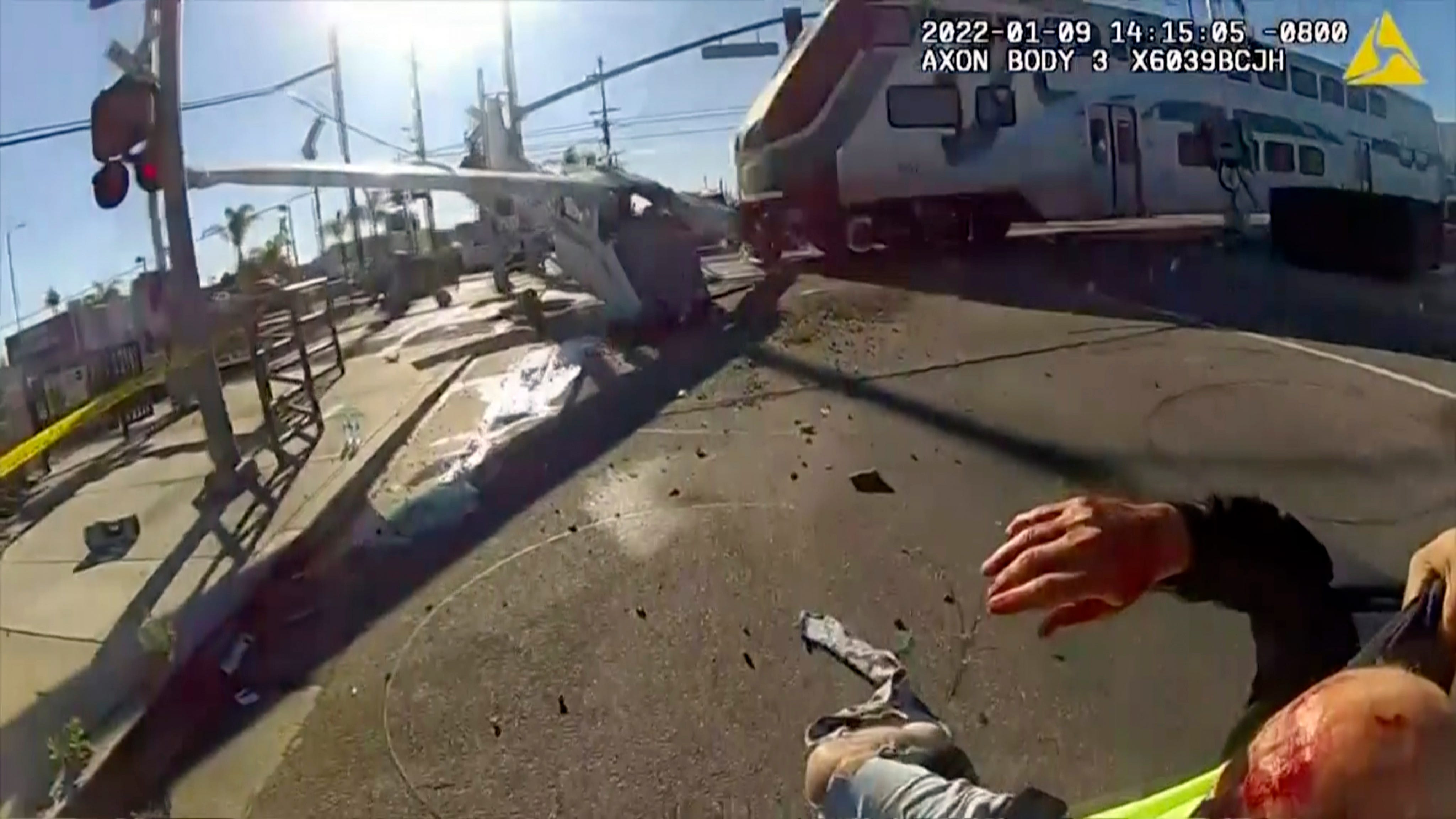 Pilot rescued from wreckage in LA moments before train hits