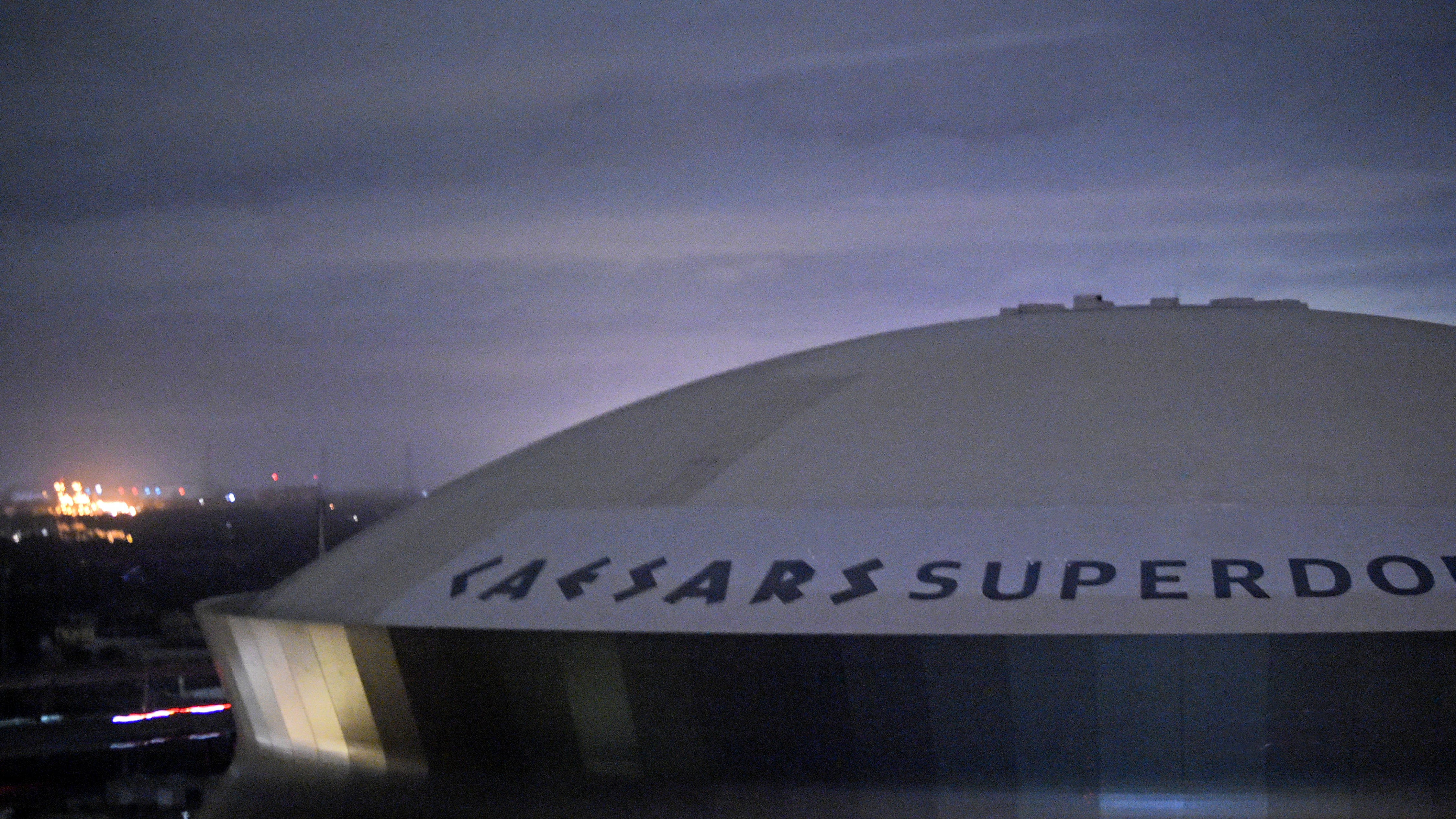 Flames pour from section of Superdome roof in New Orleans