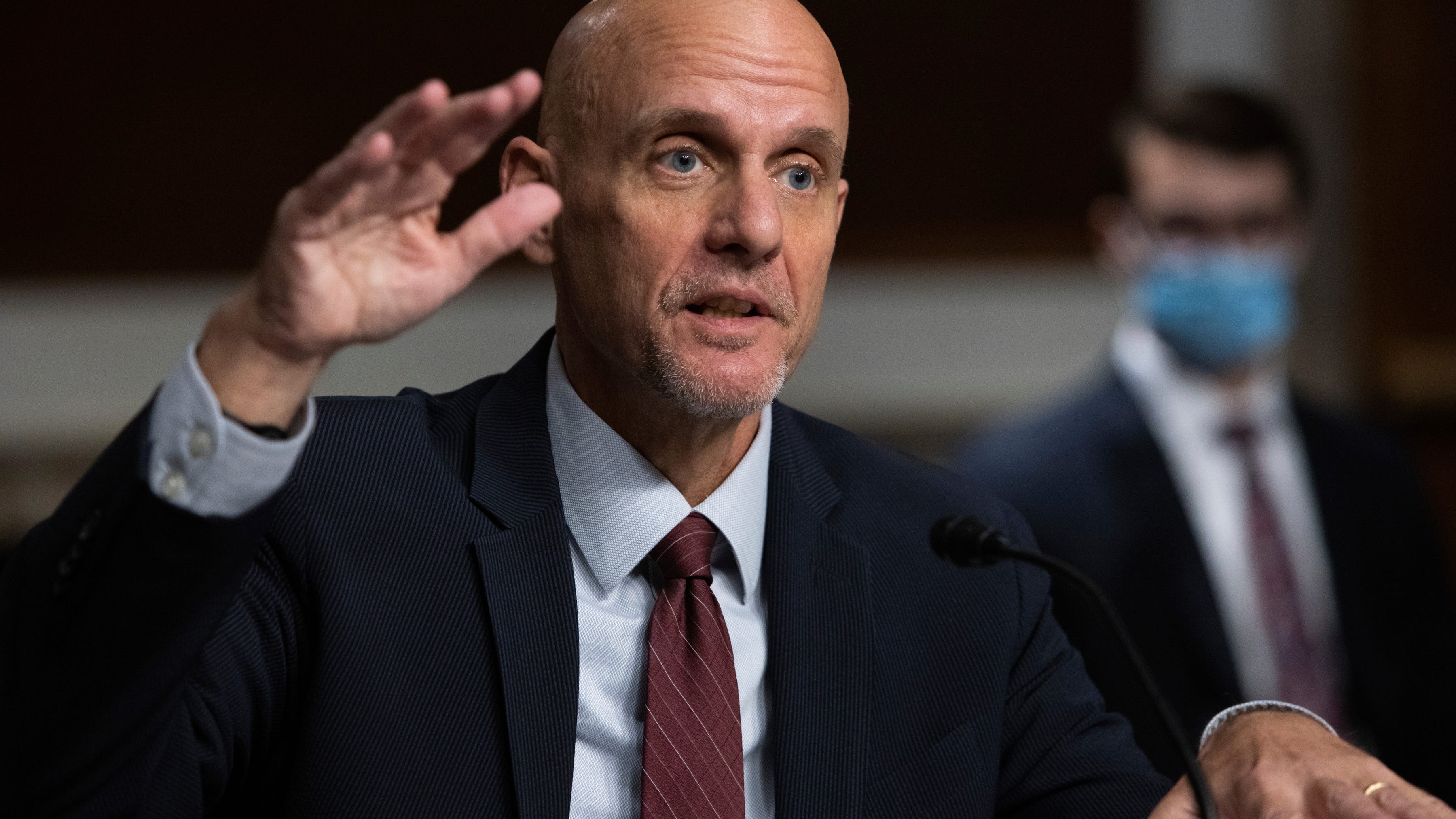 White House threatens FDA chief's job over vaccine approval