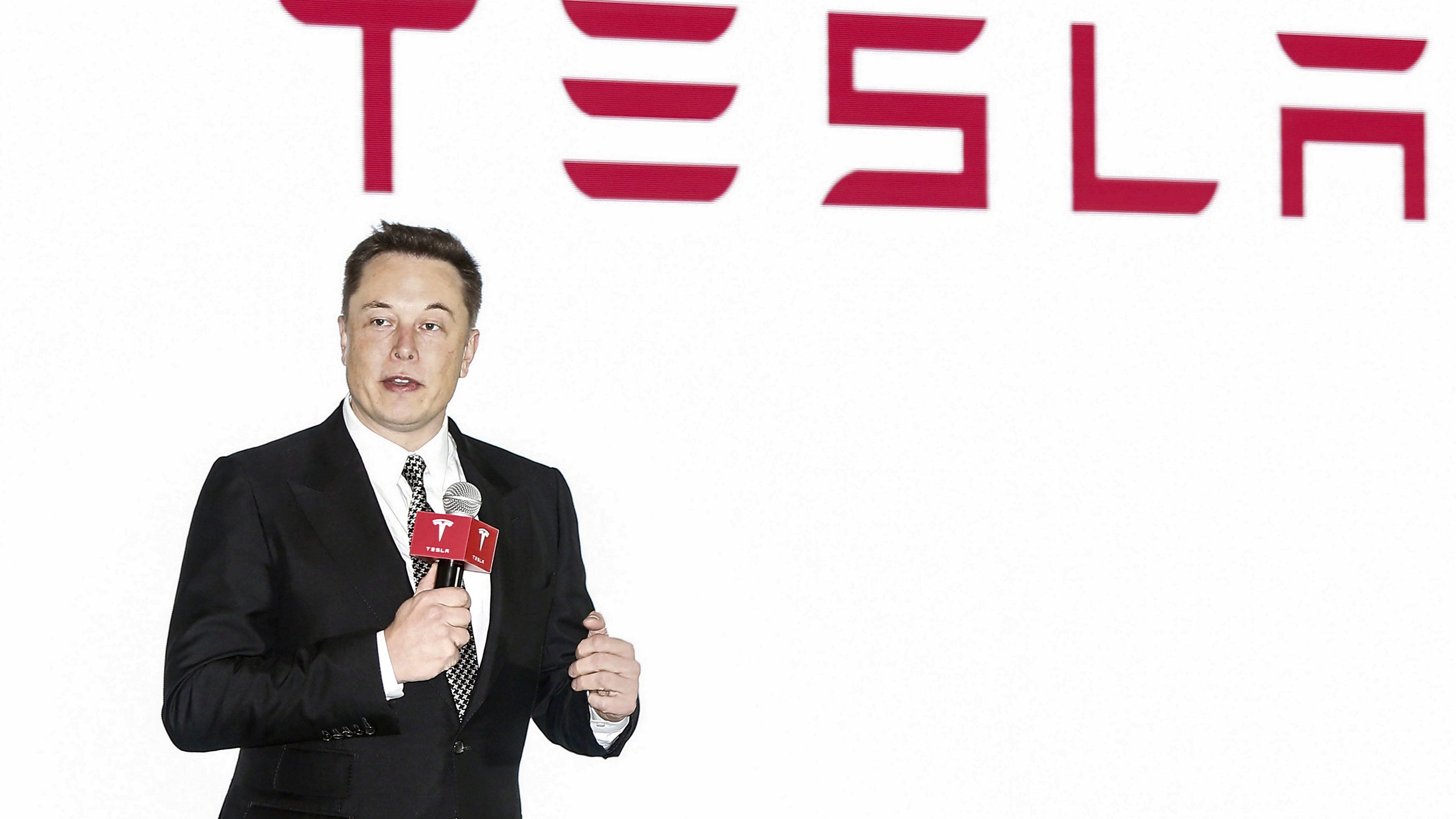 Activists urge Tesla to close new Xinjiang showroom