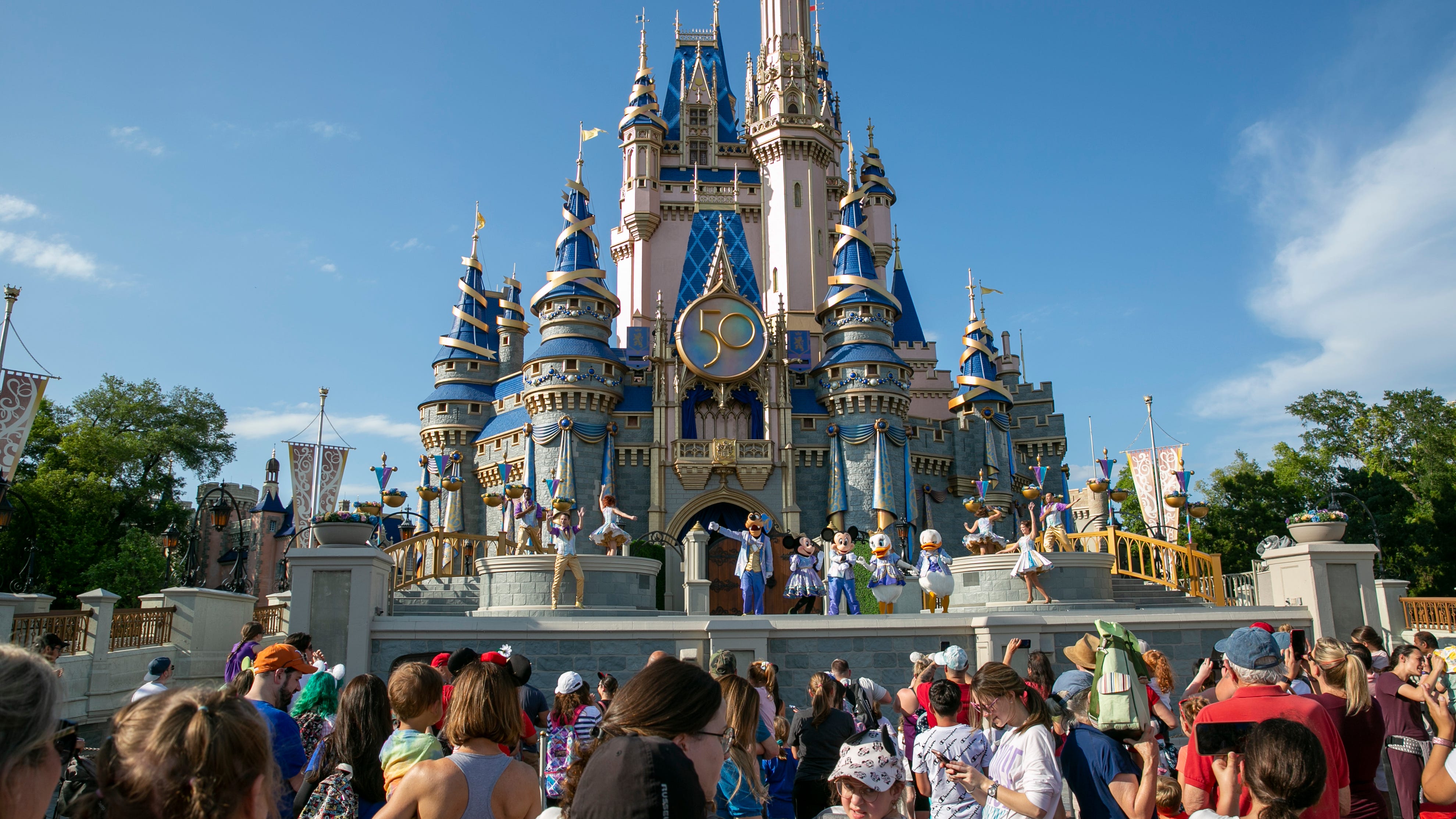 Change in title with men working at Disney dress-up shops