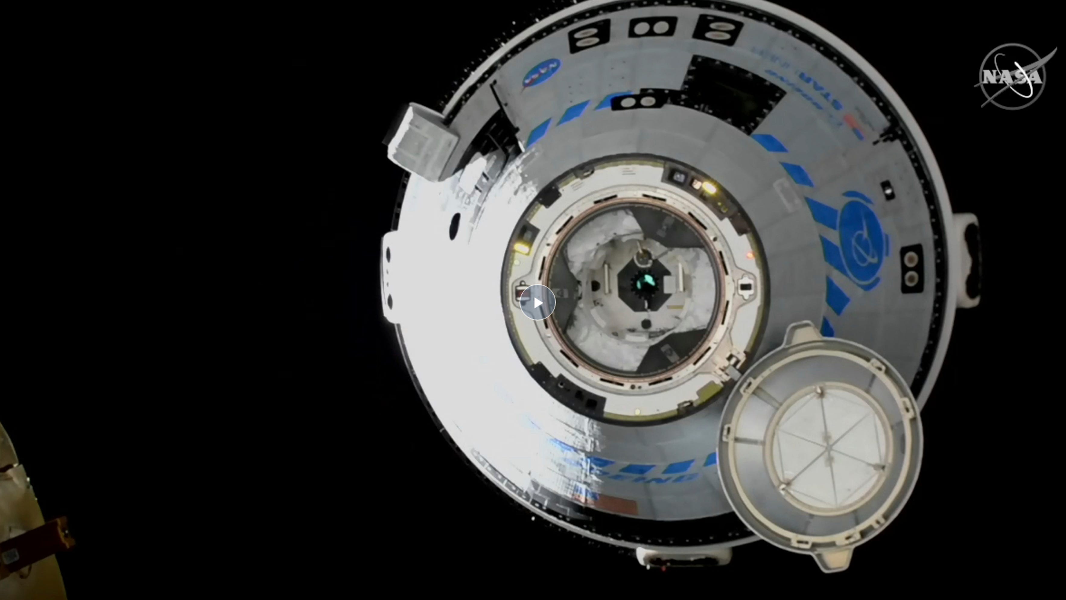 Boeing docks crew capsule to space station in test do-over