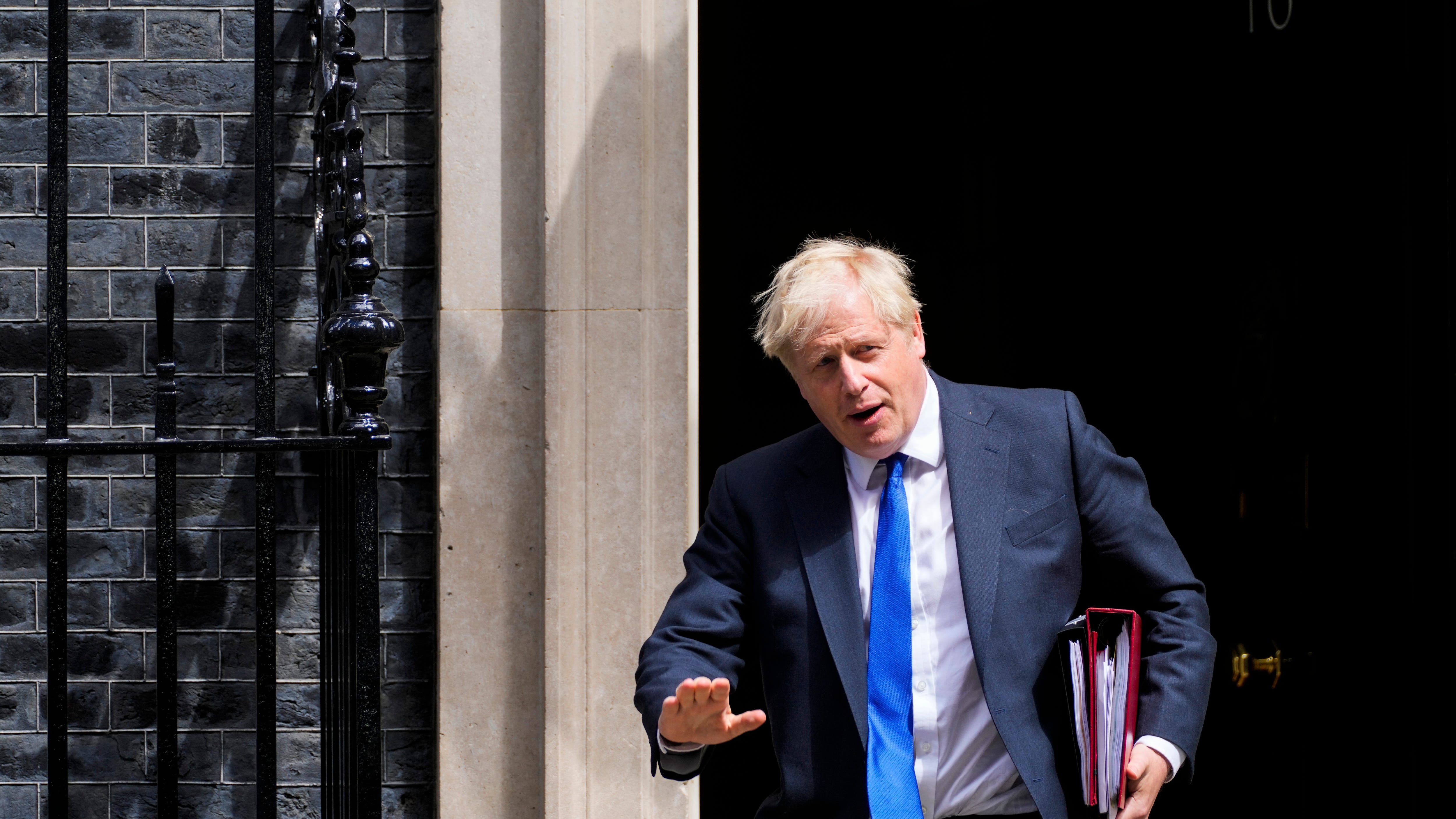 UK's Johnson battles to stay in job after top ministers quit