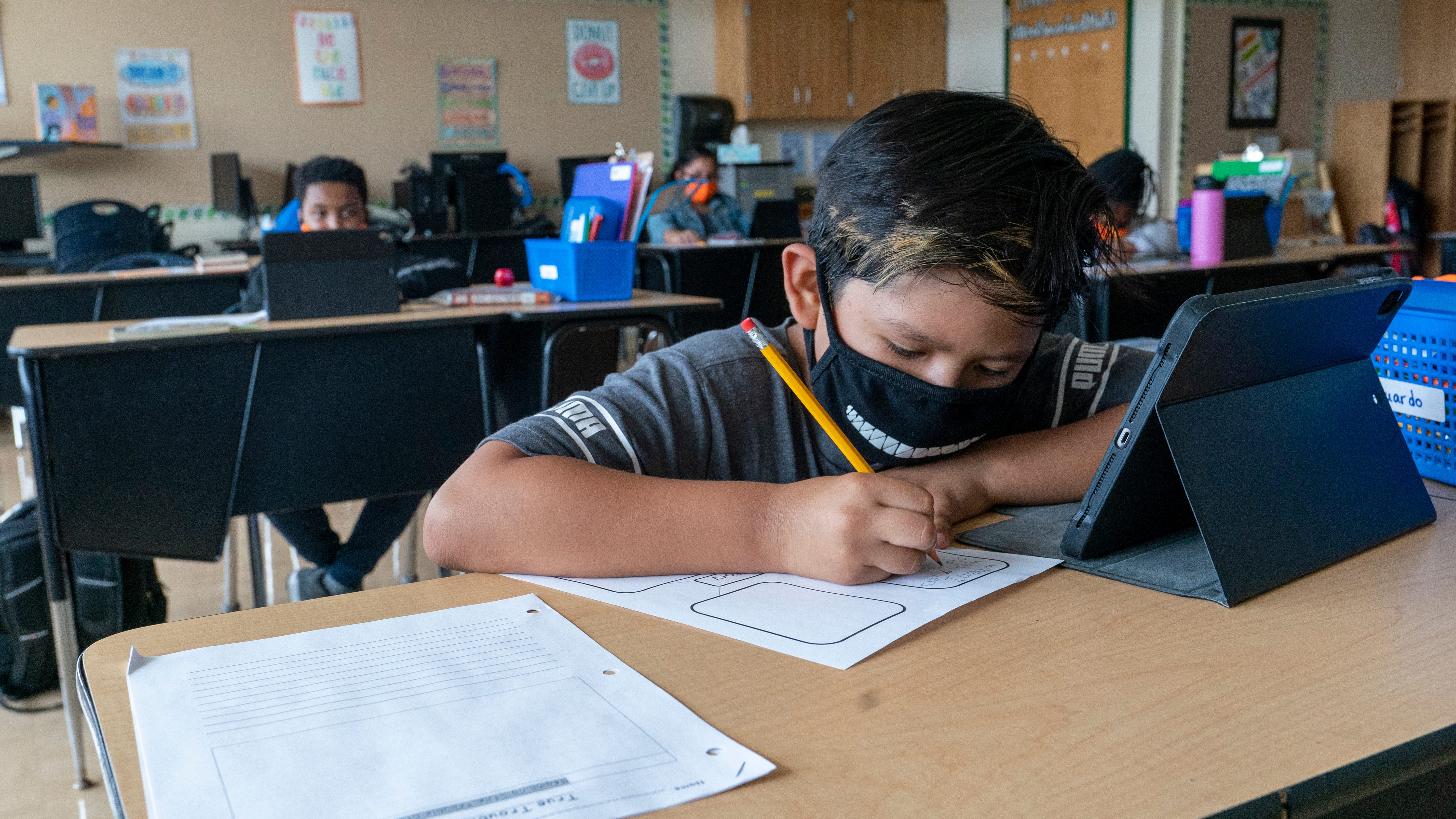 EXPLAINER: Why masks are again advised for everyone indoors