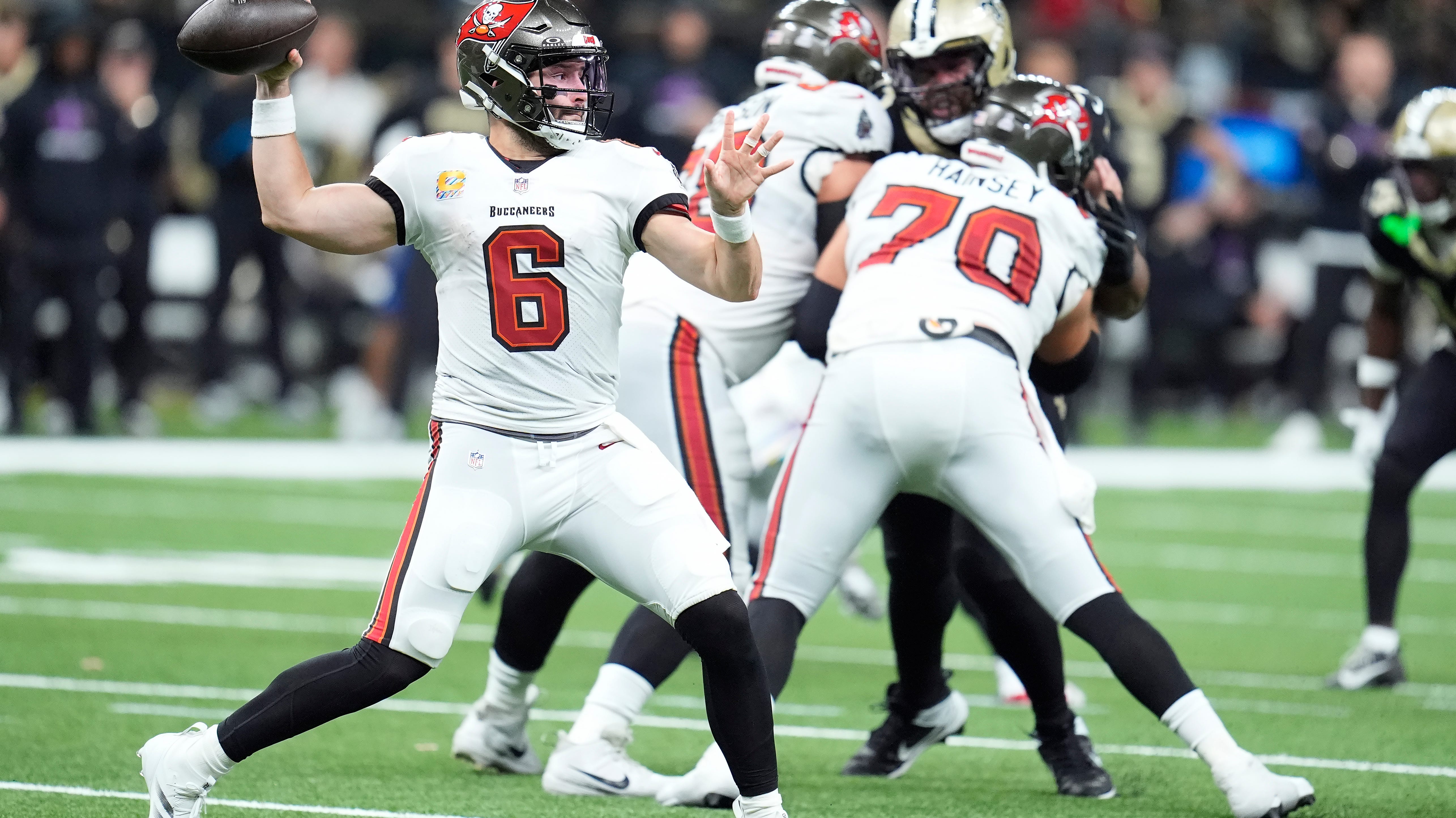 Mayfield passes for 4 TDs as the Bucs treat storm-weary fans to a 51-27 win over the Saints