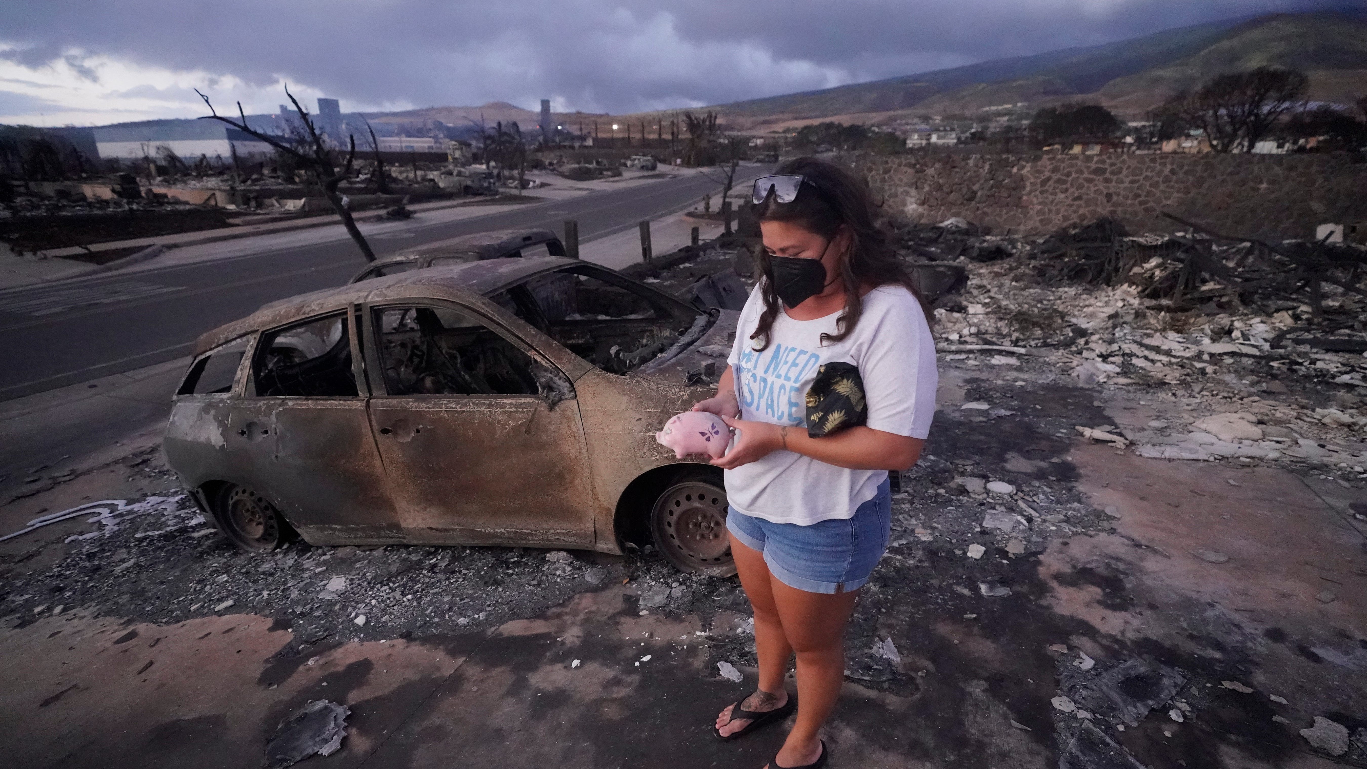 Devastation comes to light as Maui residents slowly return to charred remains of historic town