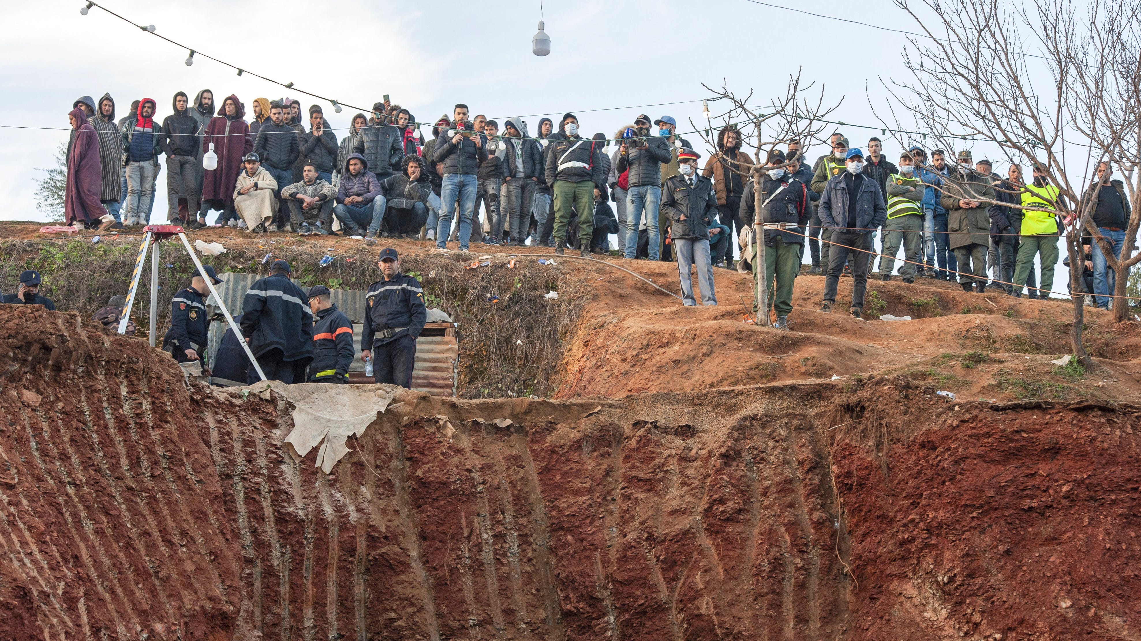 Moroccan rescuers dig to save boy stuck down well for 2 days