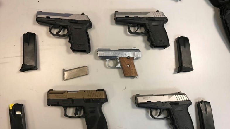 US authorities charge more than 100 with gun, drug crimes