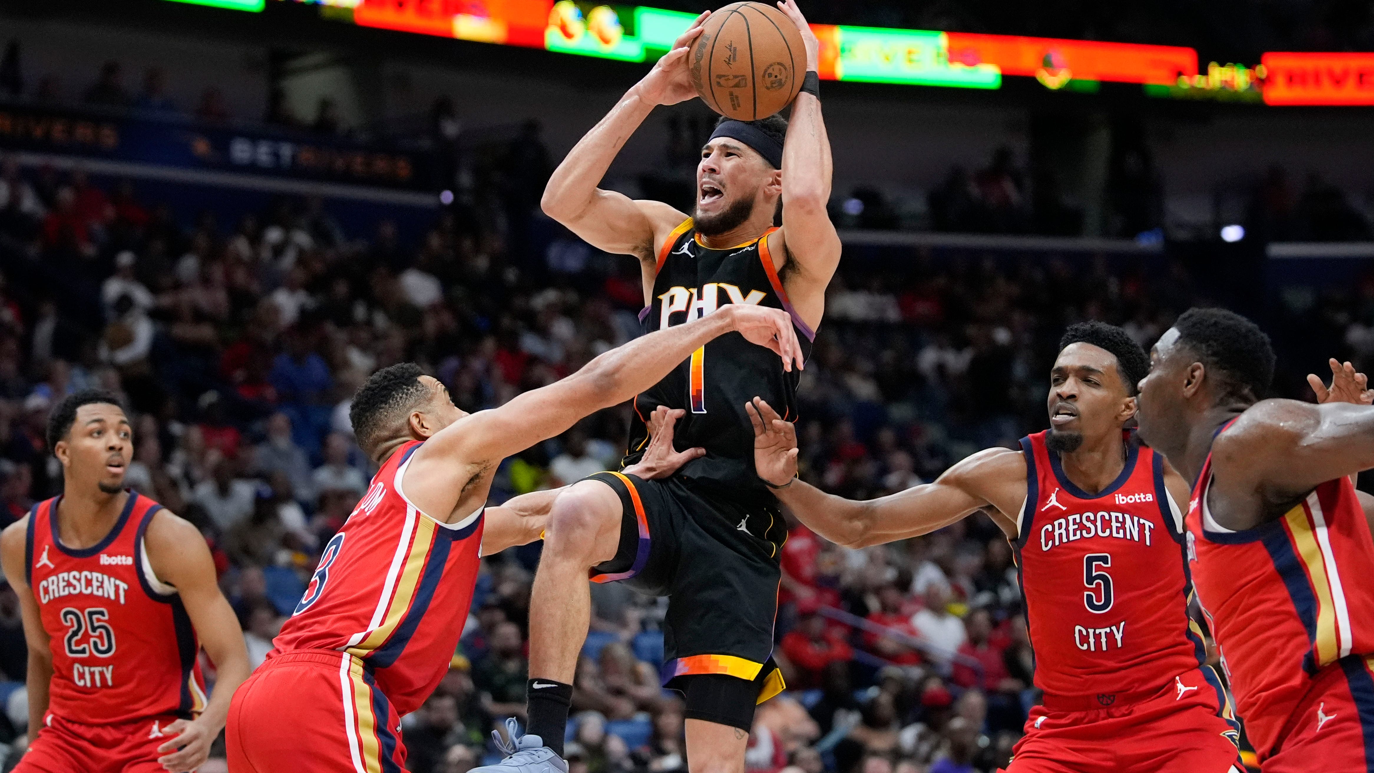 Devin Booker scores 52 points to lift the Suns over the Pelicans 124-111