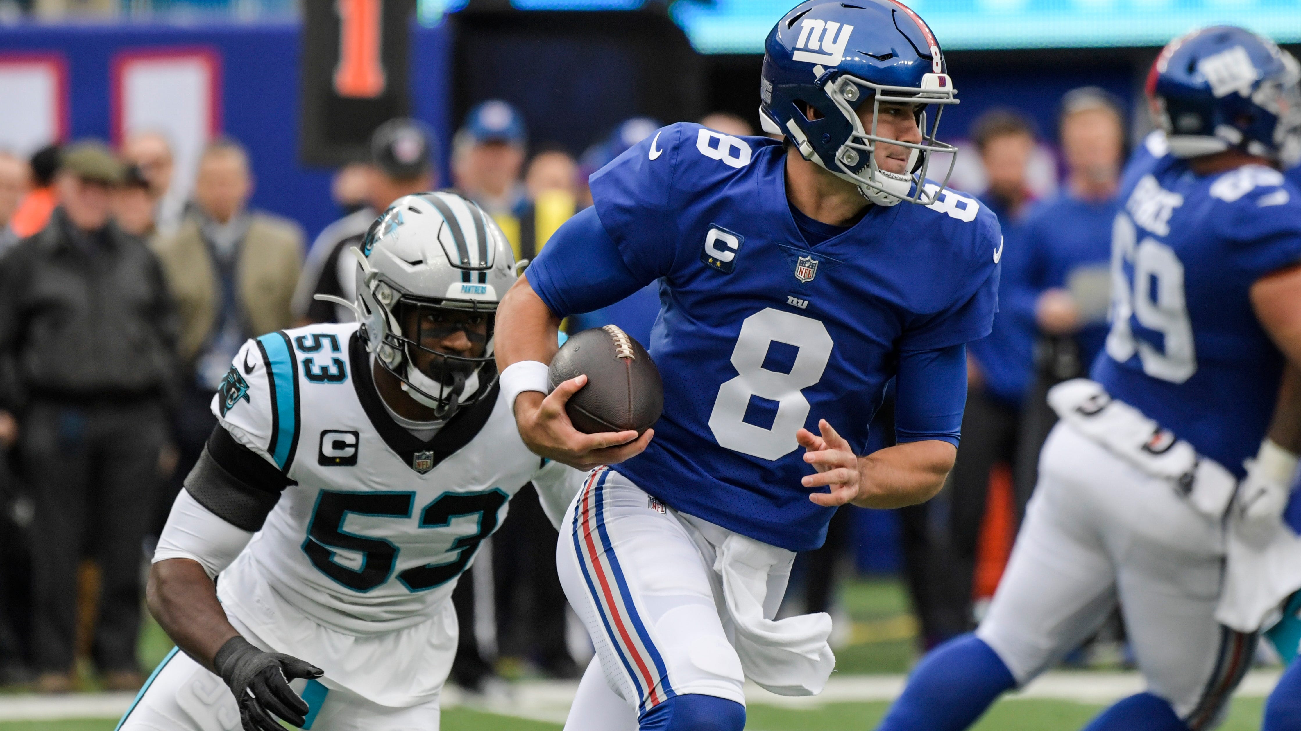 Jones passing and catching, Giants D spark win over Panthers