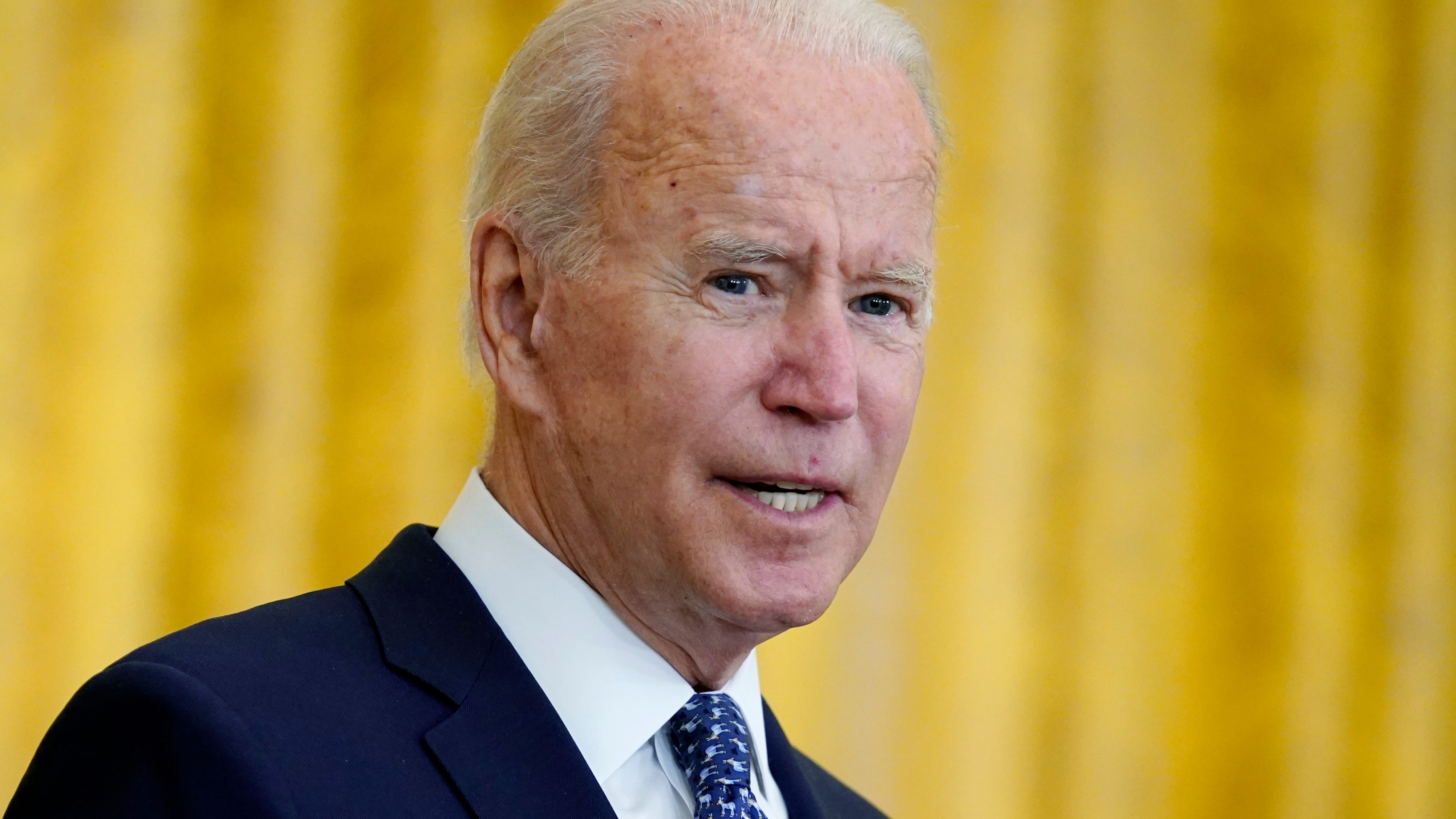 AP source: Biden requiring federal workers to get COVID shot