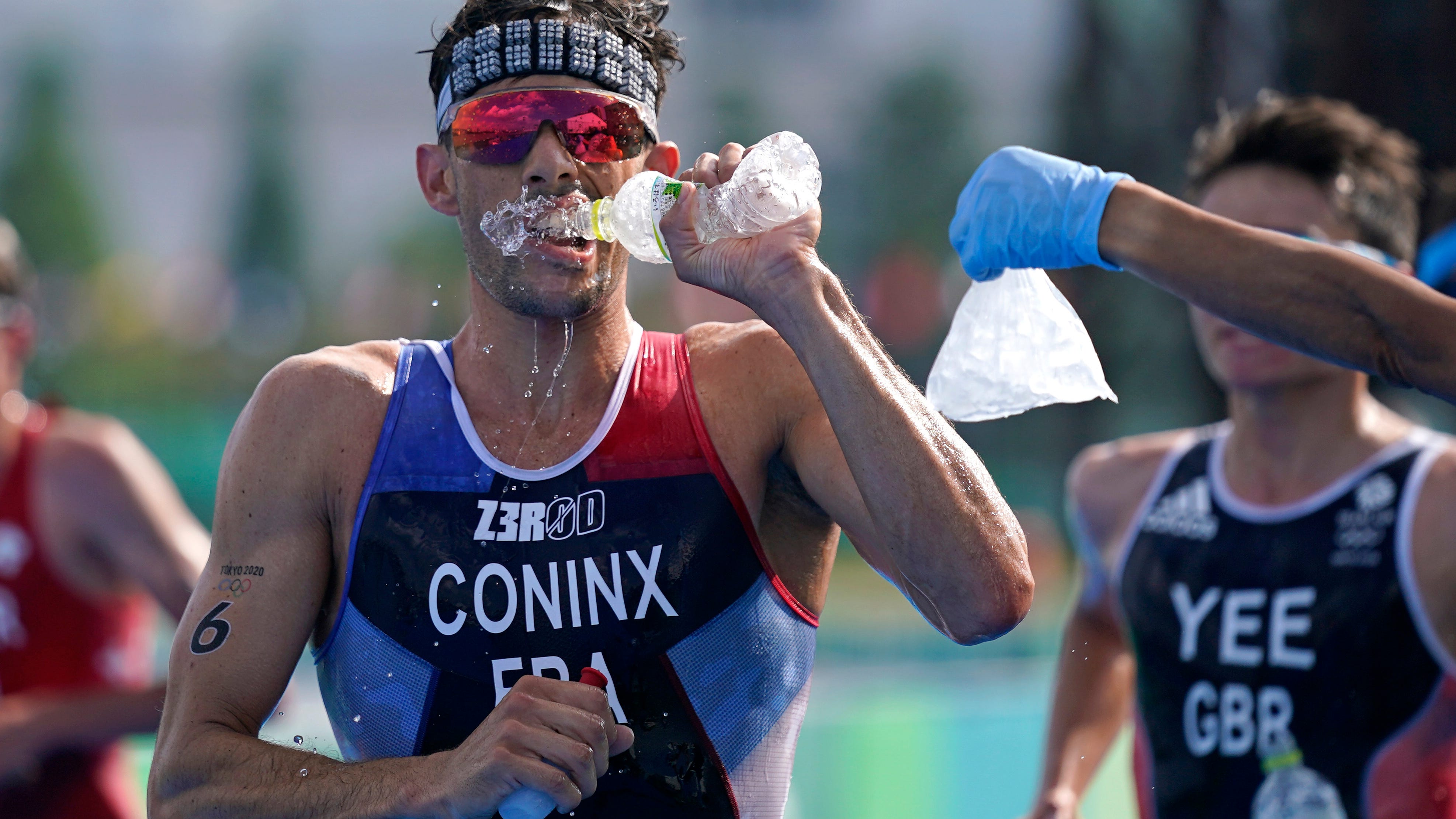 Pandemic Olympics endured heat, and now a typhoon's en route