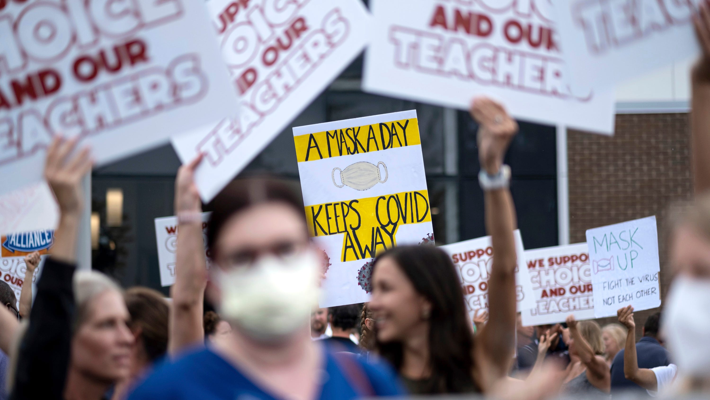 The Latest: AP-NORC poll: Vaccine requirements favored in US