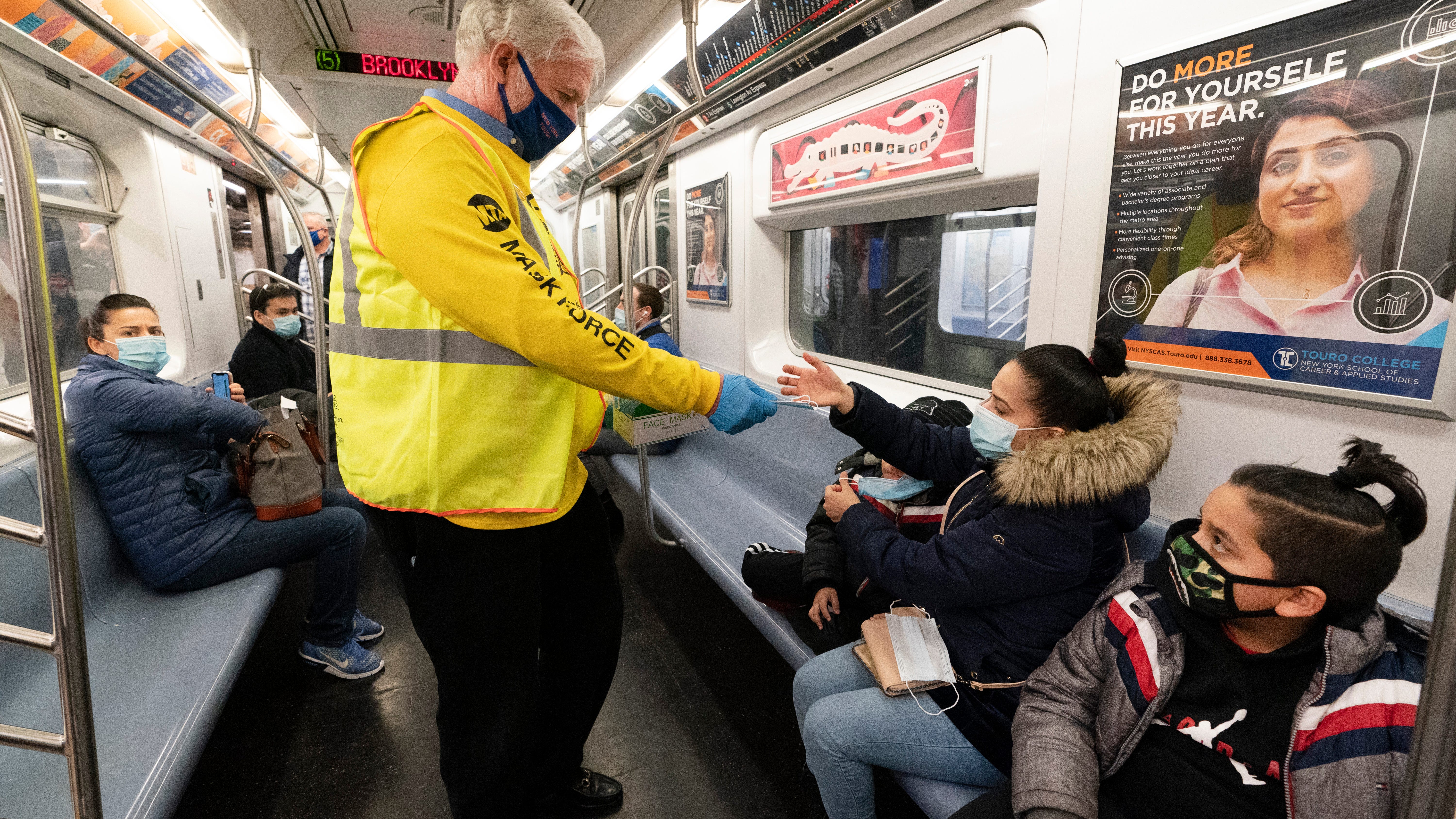 US extends mask rule for travel while weighing new approach