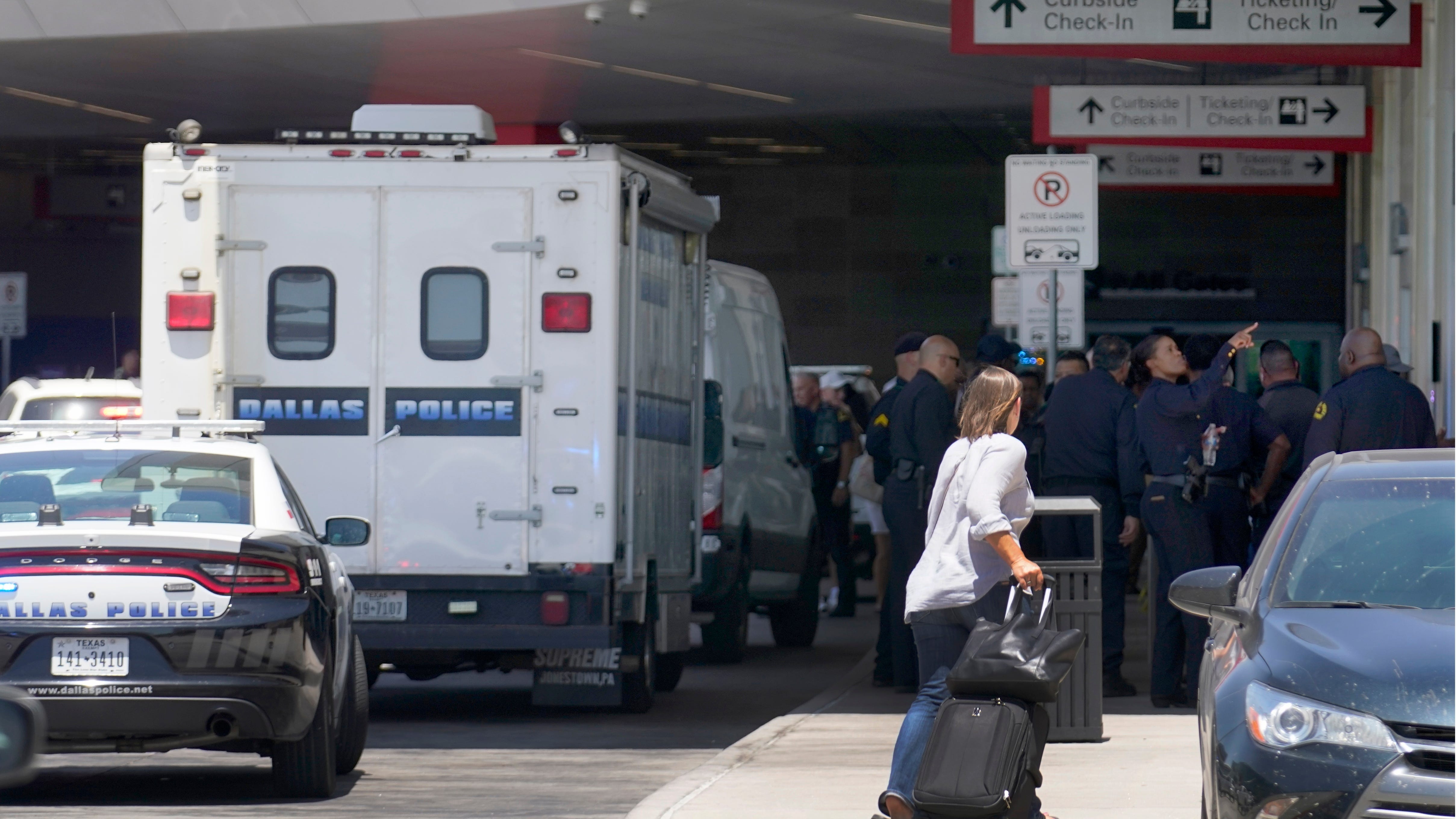 Police: Woman opened fire in Dallas airport; cop shot her