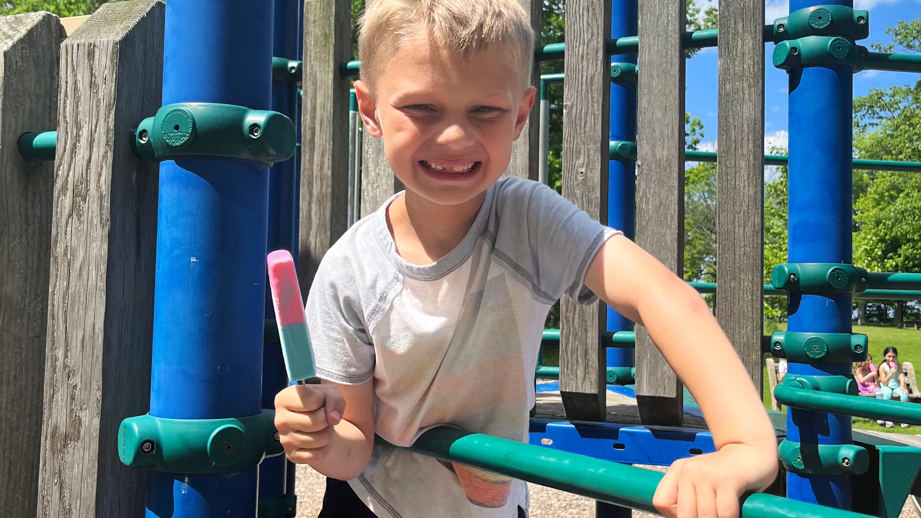 8-year-old paralyzed in parade attack awake, asking for twin