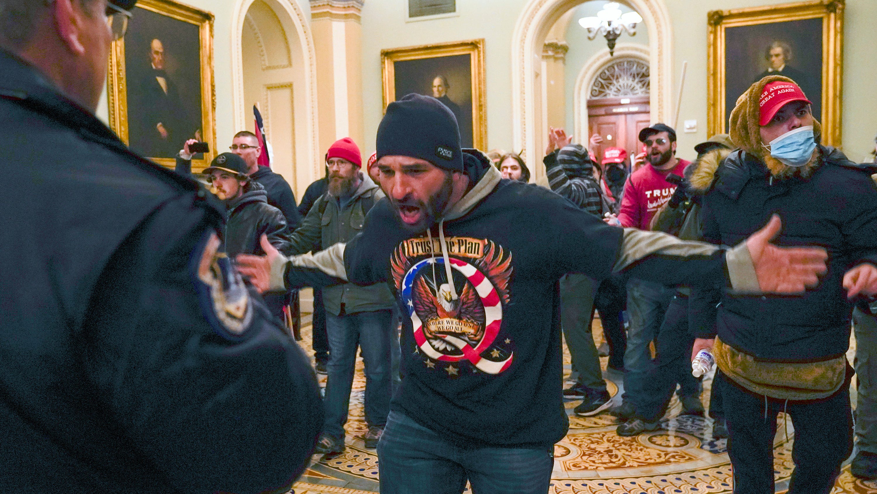 Trial opens for QAnon follower who chased officer at Capitol