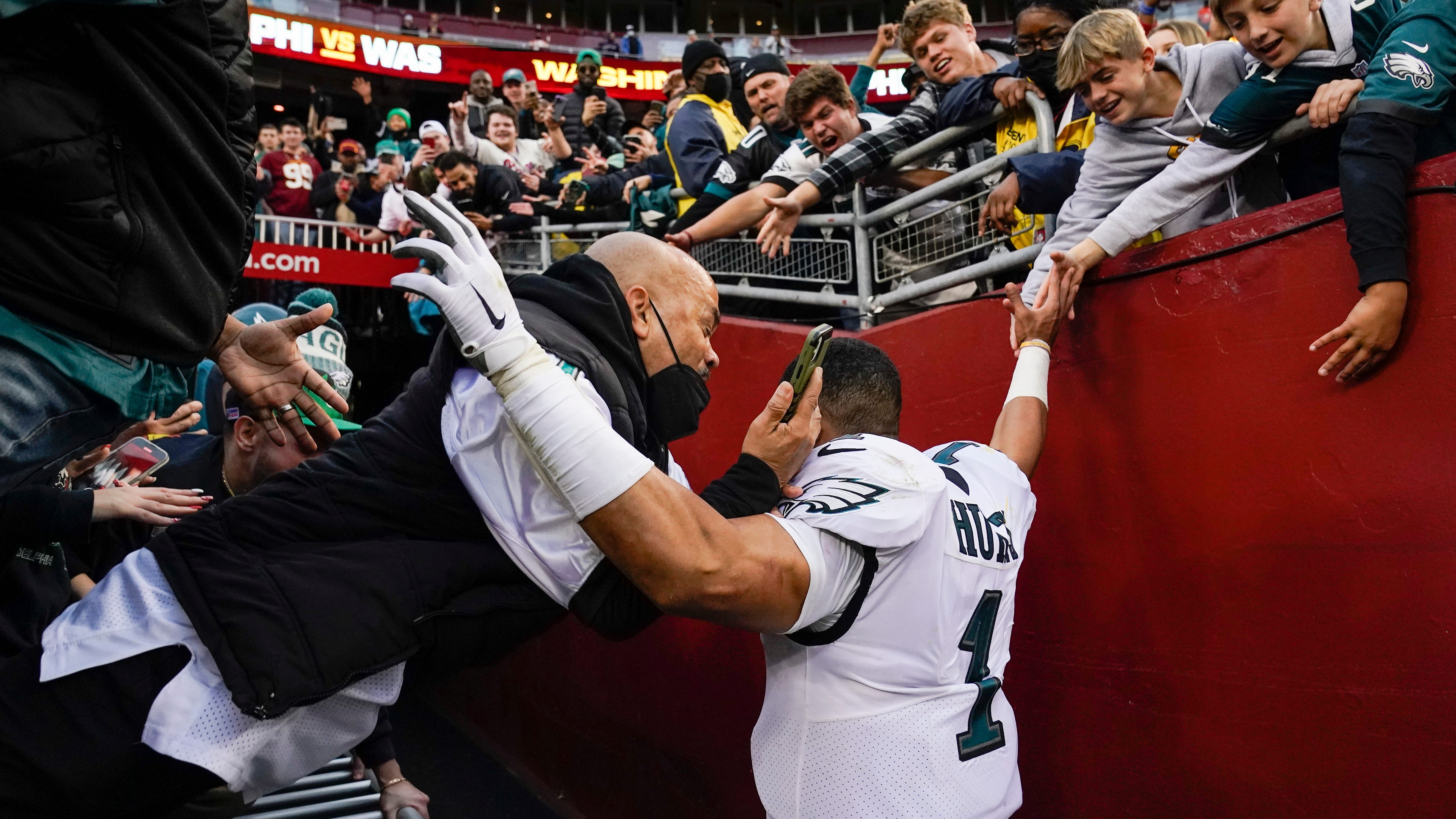 Hurts OK after railing collapse, Eagles beat Washington