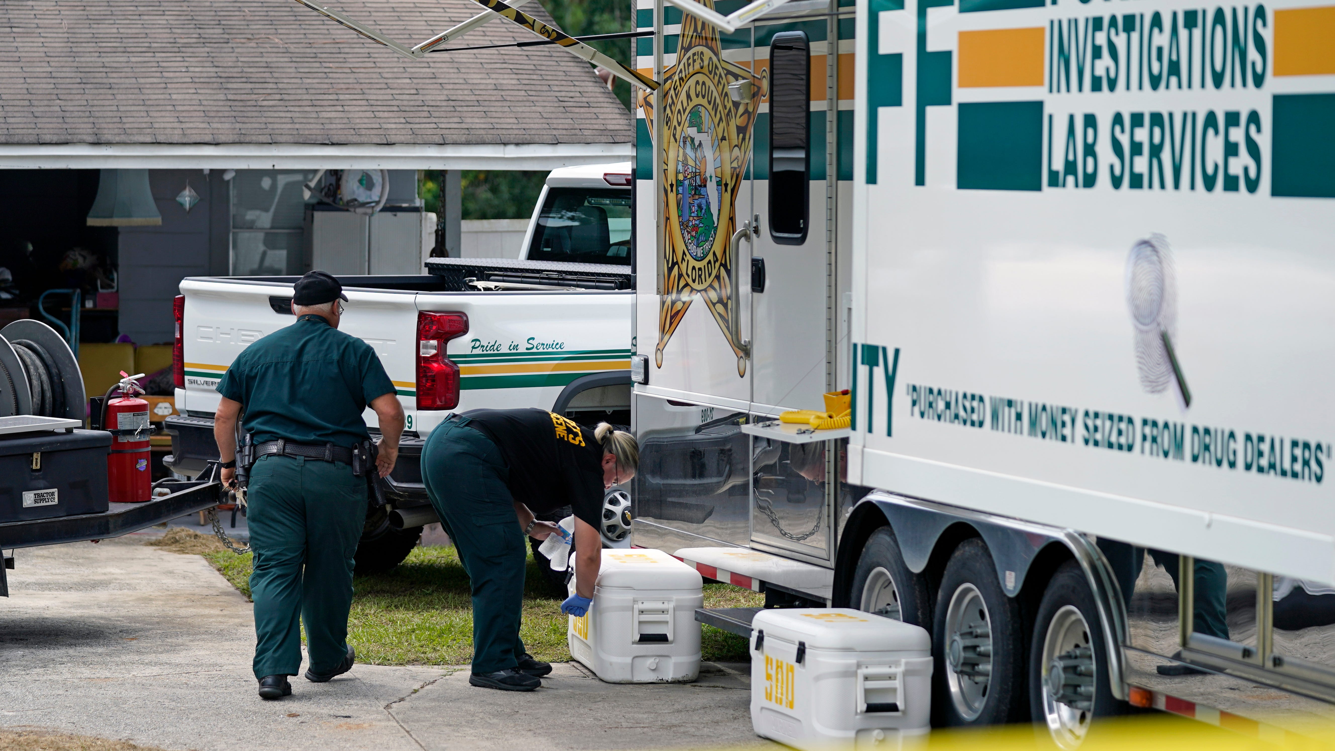 Florida shooter may have first pounded on neighbor's door 