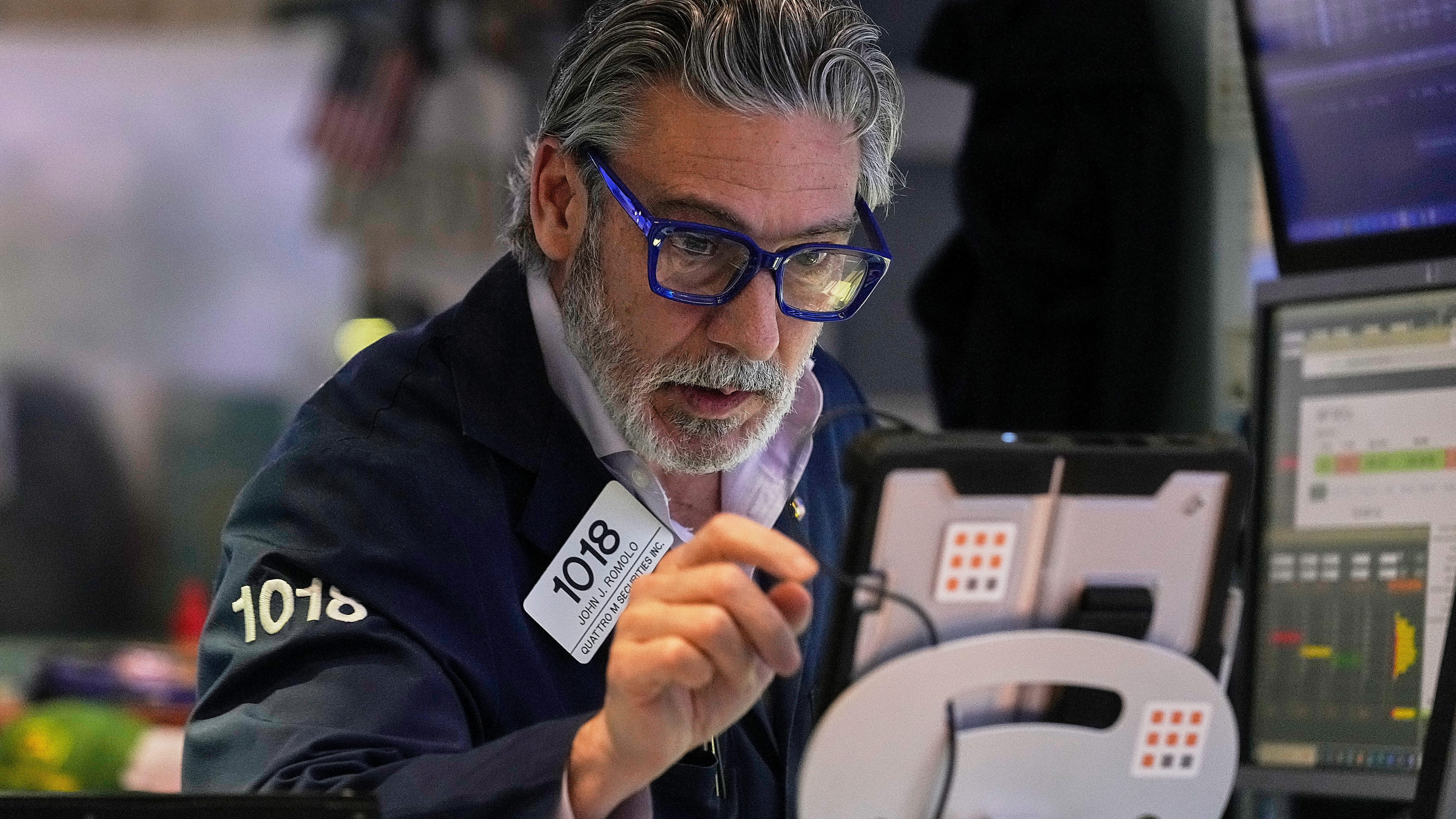 Wall Street ticks to records after shaking off worries about Trump's feud with the Fed