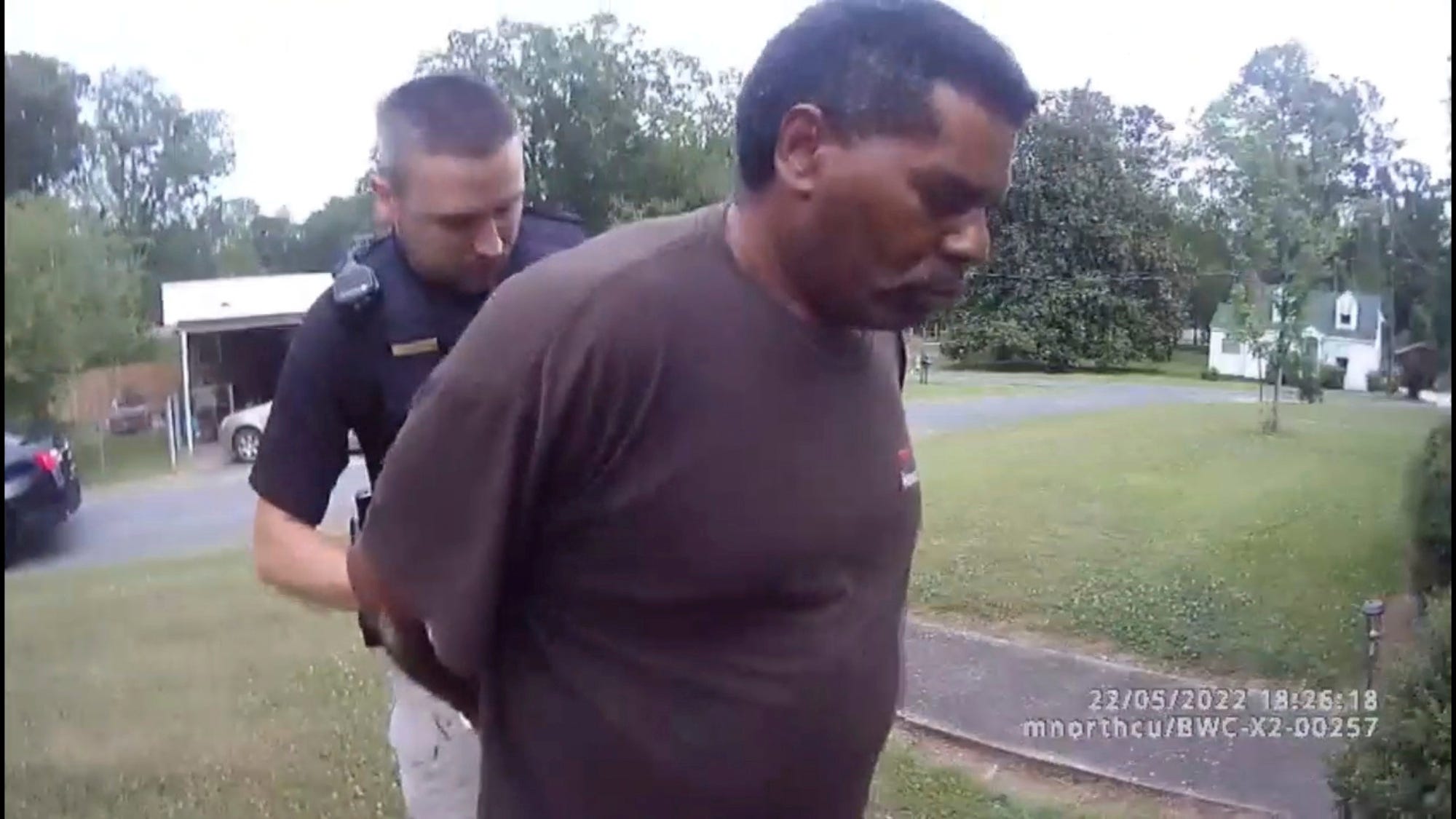 Black preacher arrested while watering flowers sues police