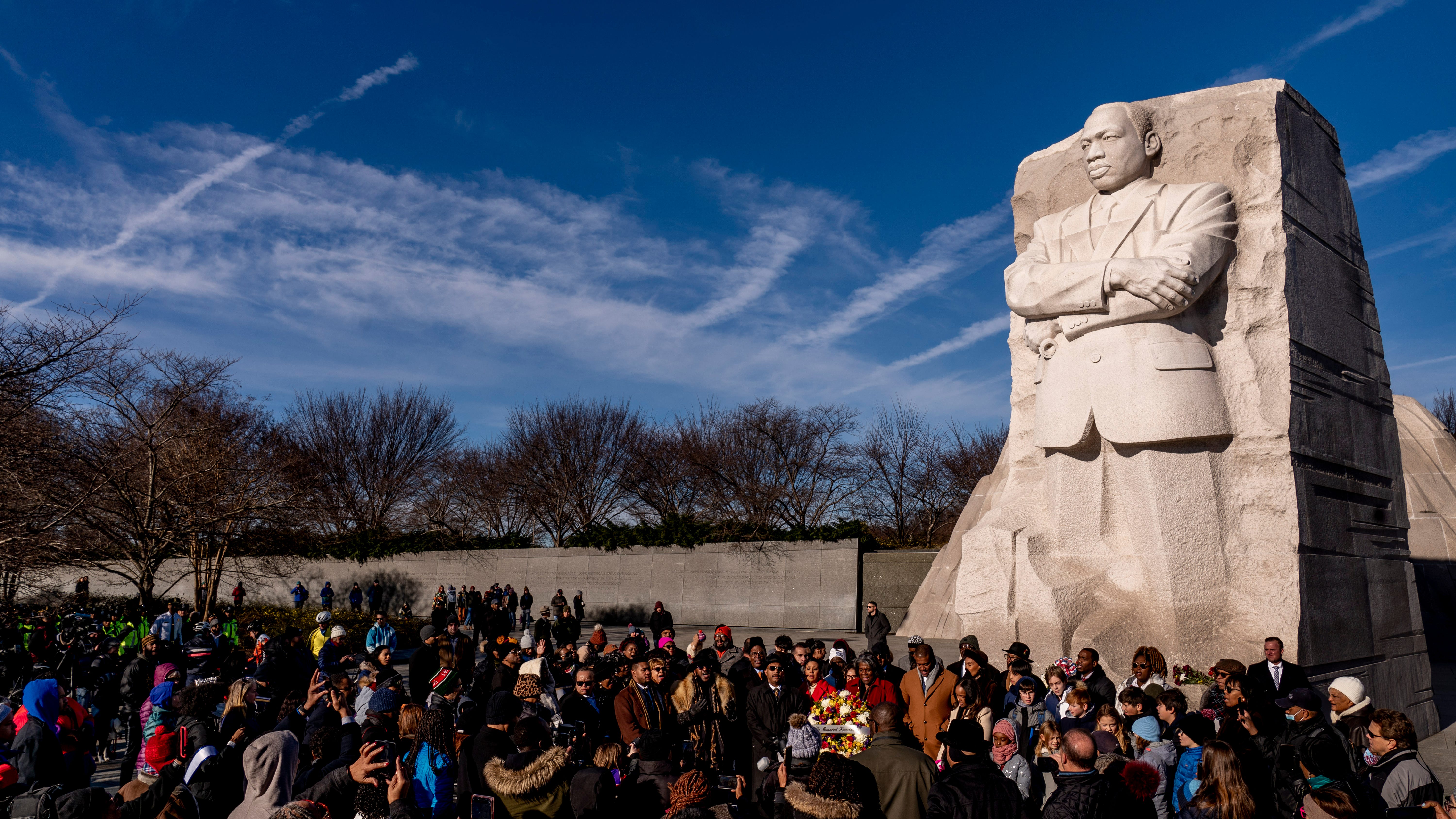 On King's holiday, daughter calls for bold action over words