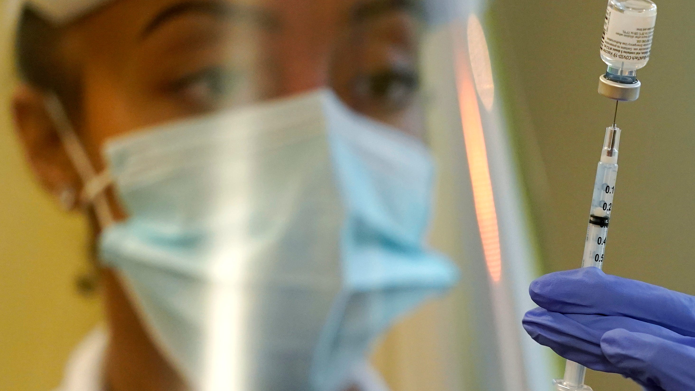 CDC leader adds people with risky jobs to COVID booster list