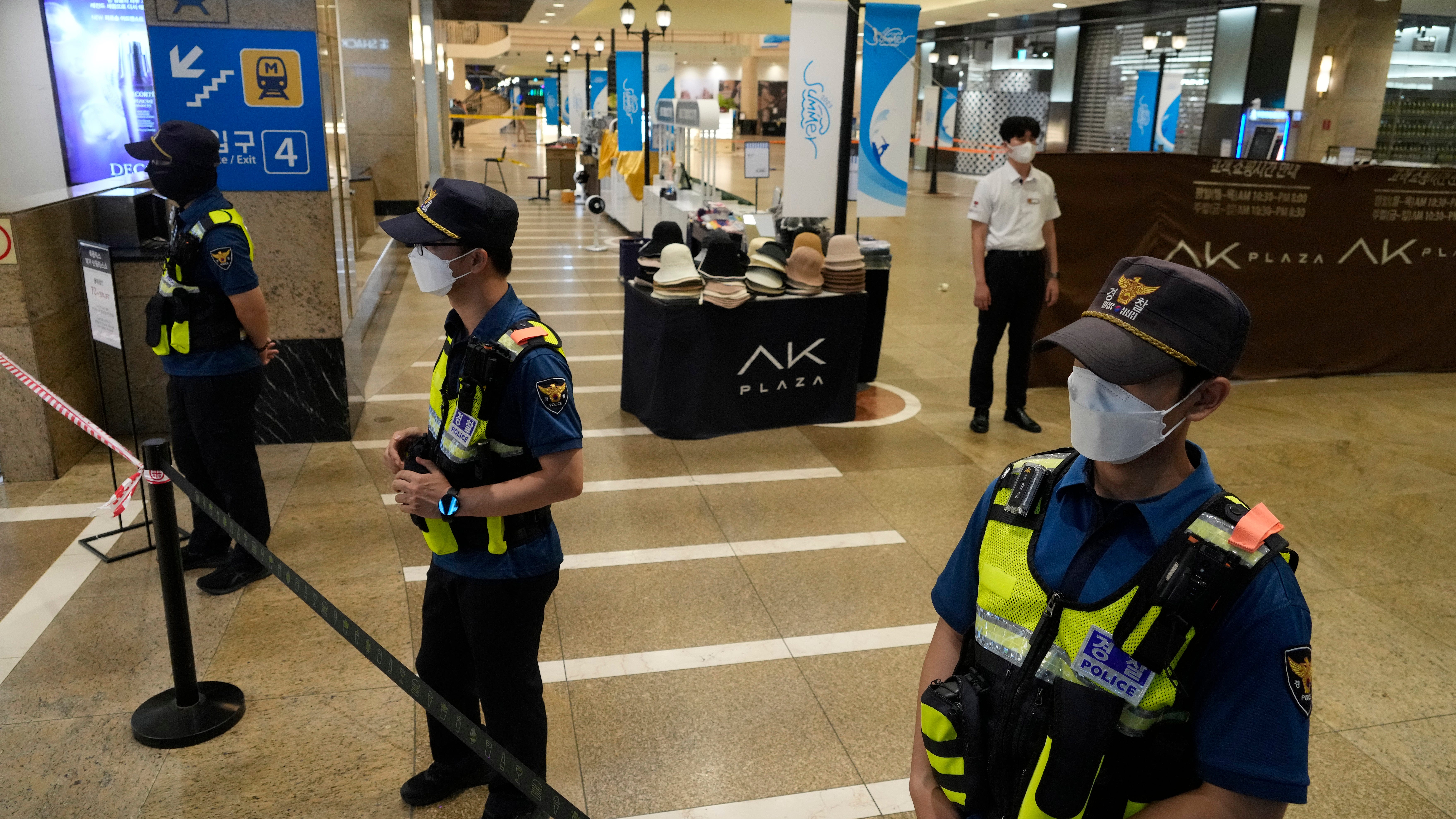 Man rams car onto sidewalk in South Korea and stabs people; at least 14 hurt