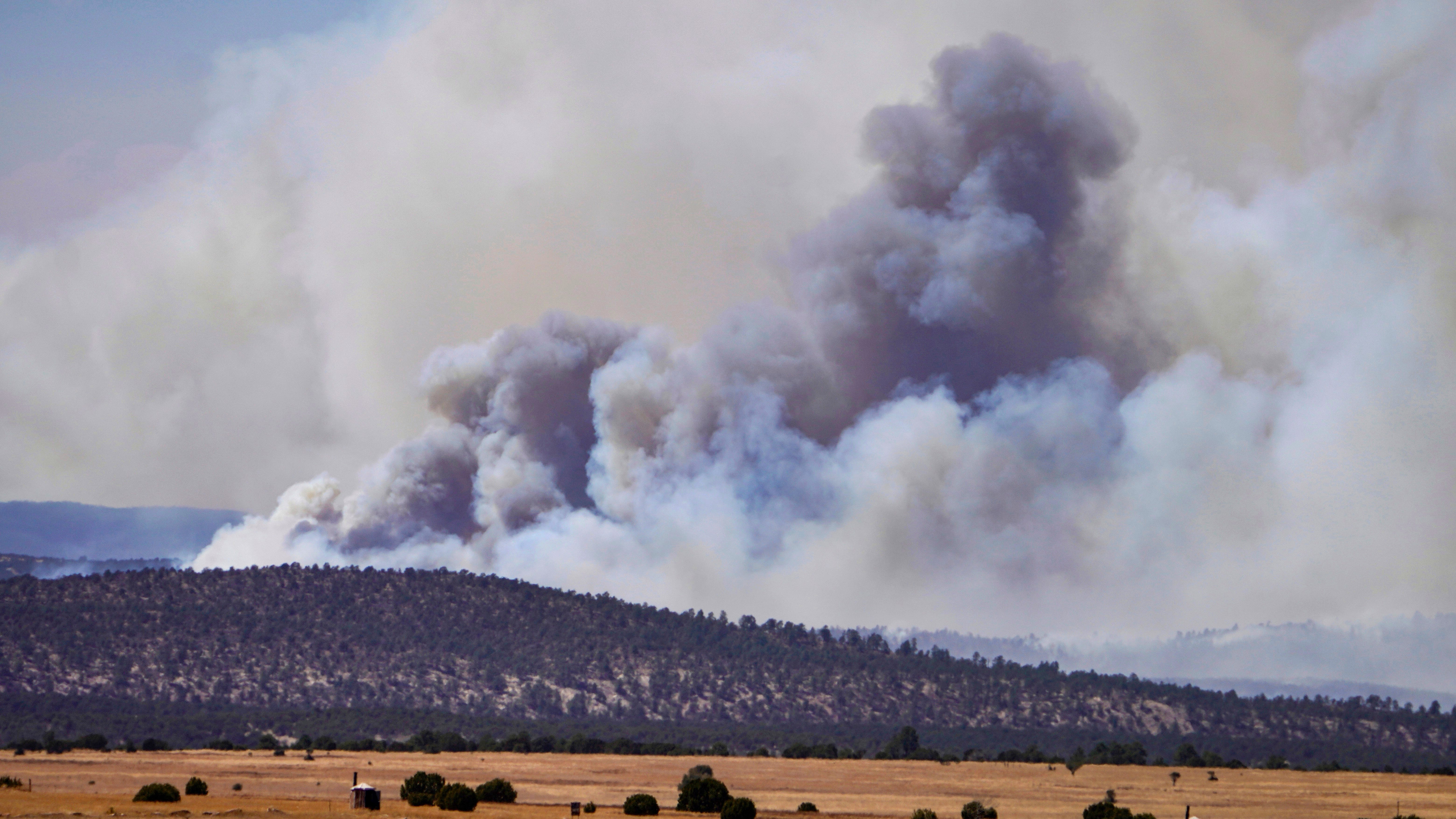 Fire crews close in around massive New Mexico wildfire