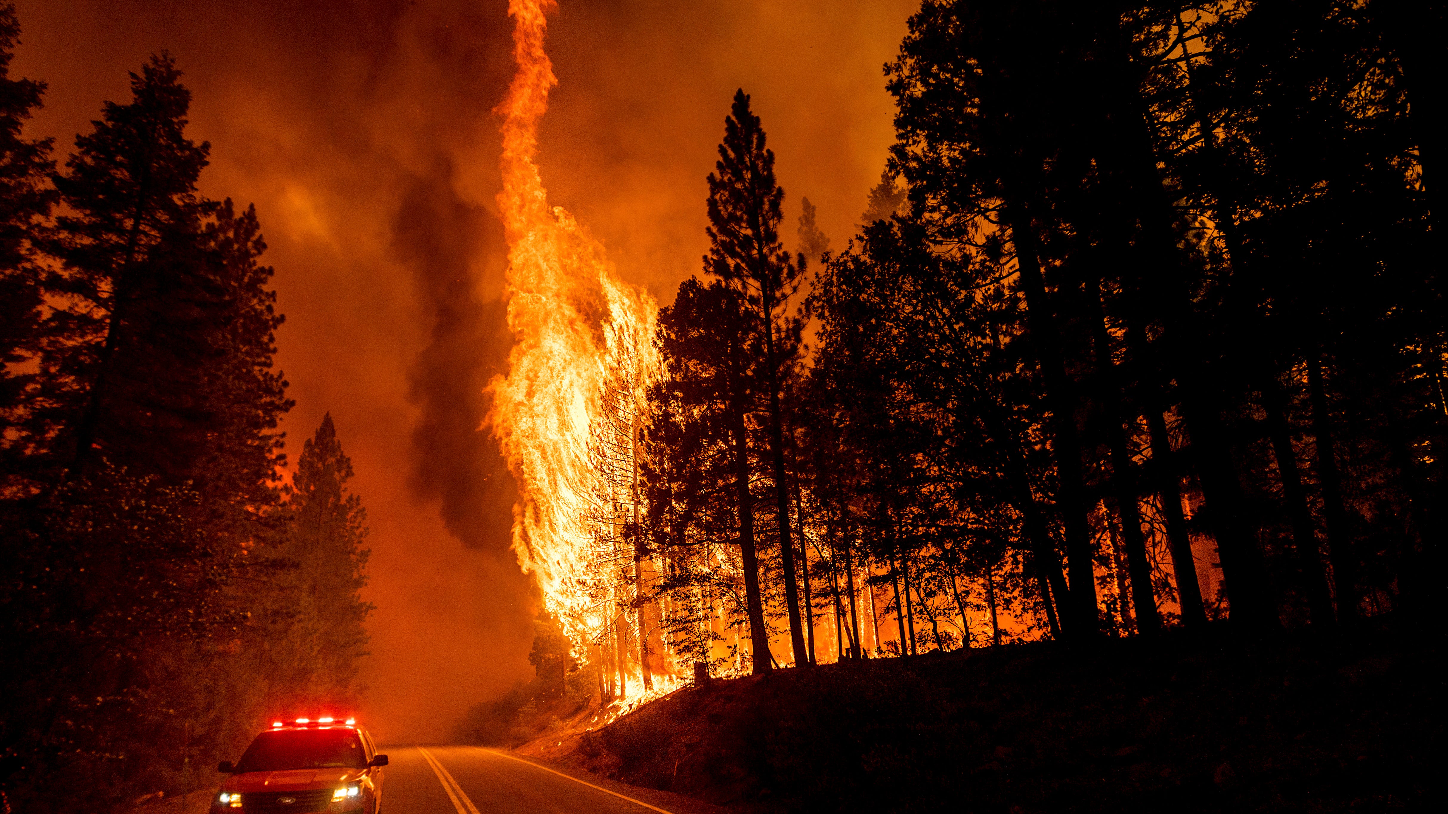 Huge California fire grows as heat spikes again across state
