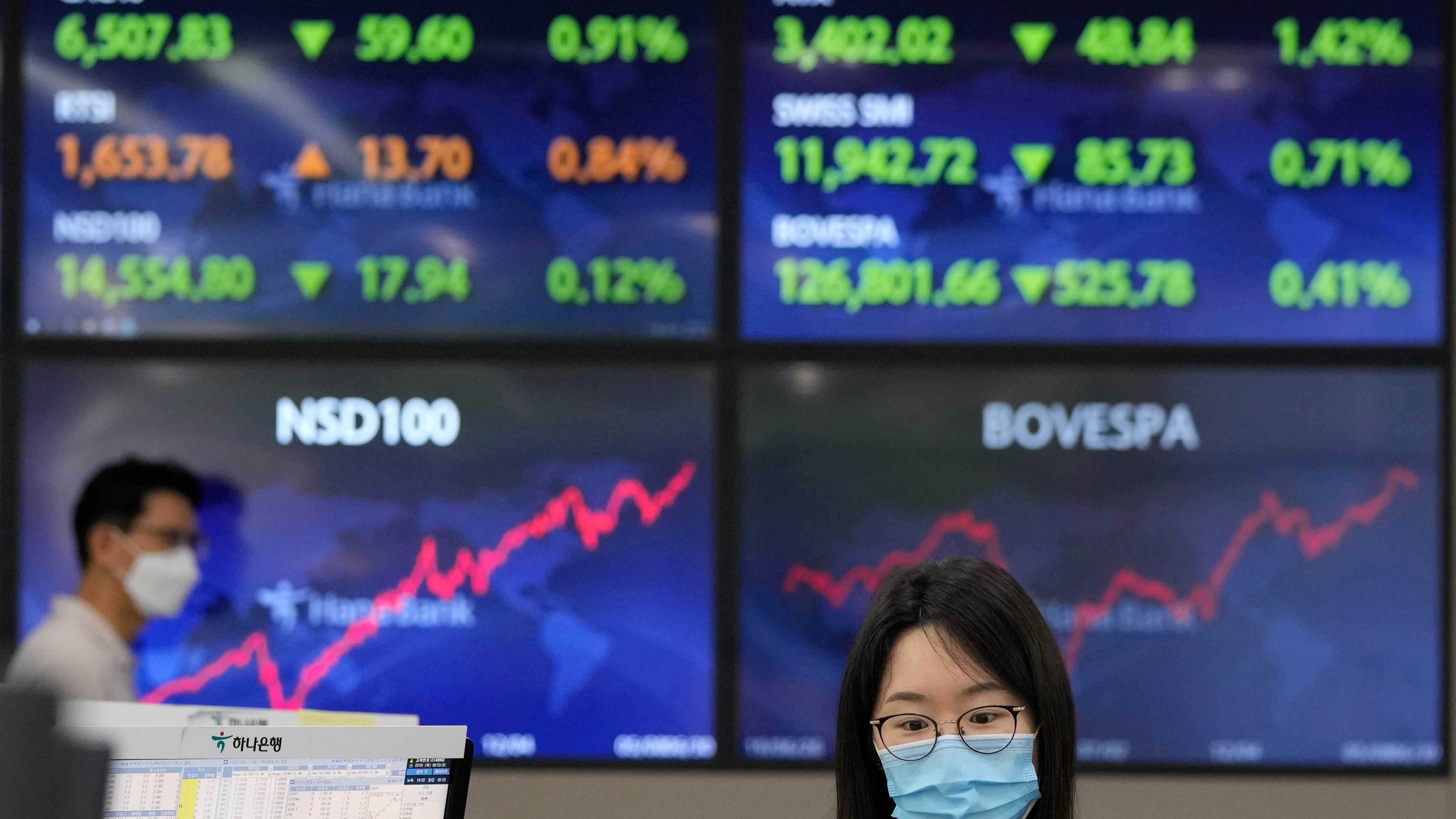 Wall Street hits another record; energy stocks, banks gain