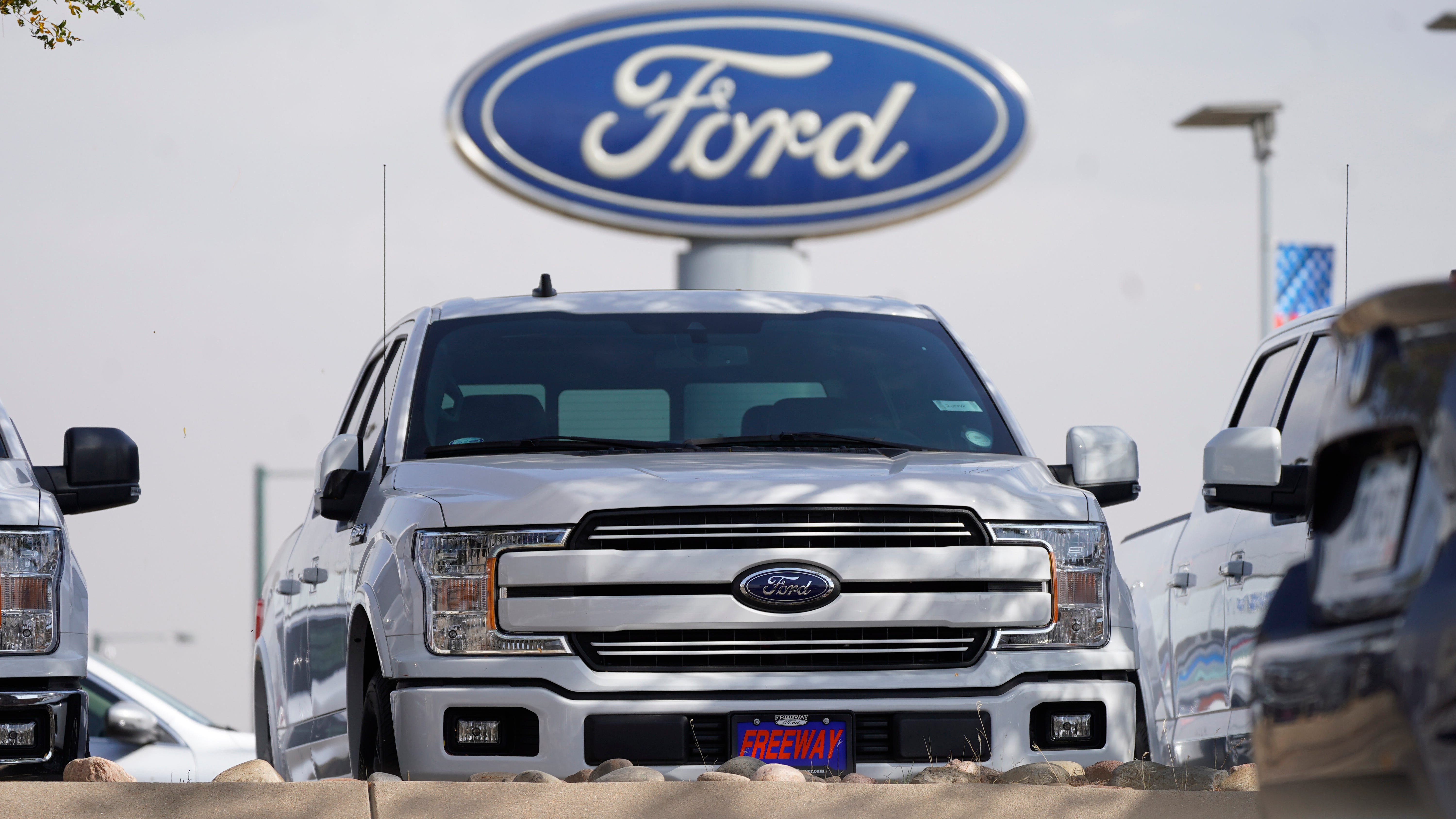 Ford posts profit, says chip shortage may cut production 50%