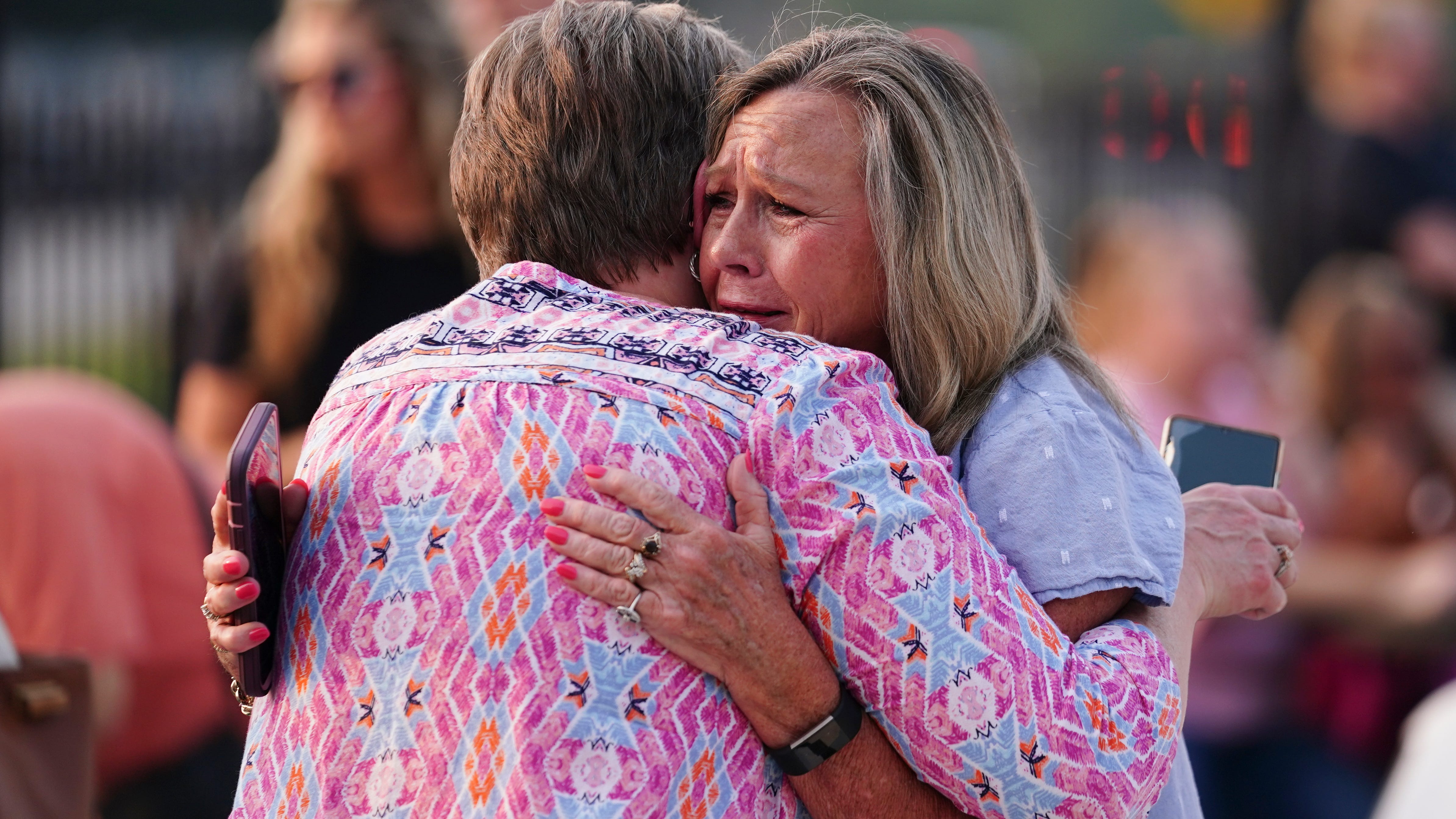 4 slain in Georgia mass shooting memorialized as neighbors gather for candlelight vigil