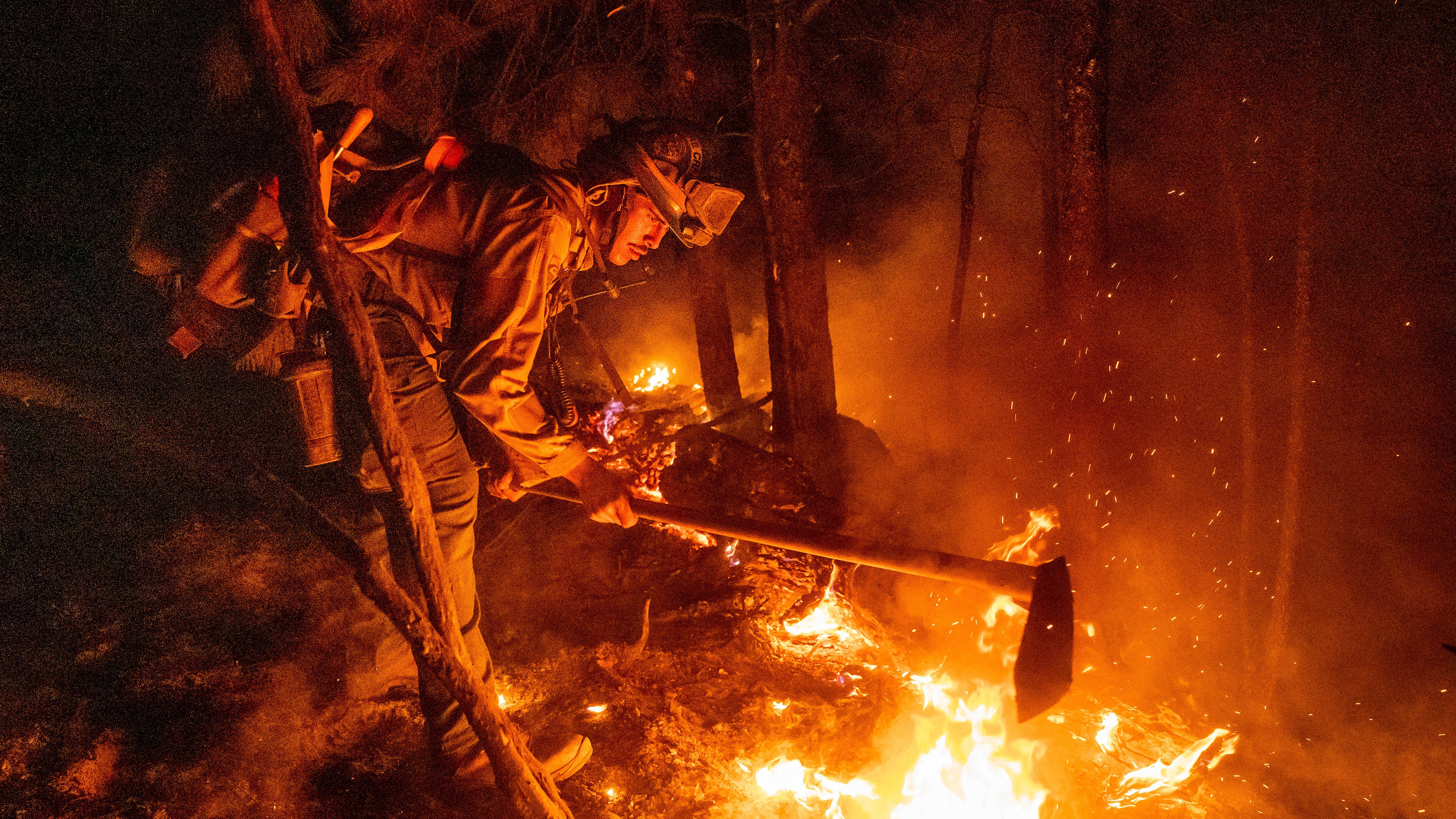 California cleans up from mudslides, as fire gains strength